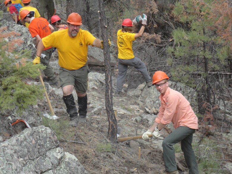 David Quebedeaux has built miles of trails as part of his job with the U.S. Army Corps of Engineers and in his volunteer position with the Boy Scouts. While at the Philmont Scout Ranch this summer, Quebedeaux (left) and Eagle Scout Marshall Knox (right) and the rest of the crew helped lay out and begin construction on a new section of trail near the Cimarron River, shown here June 14, 2013. Courtesy photo.