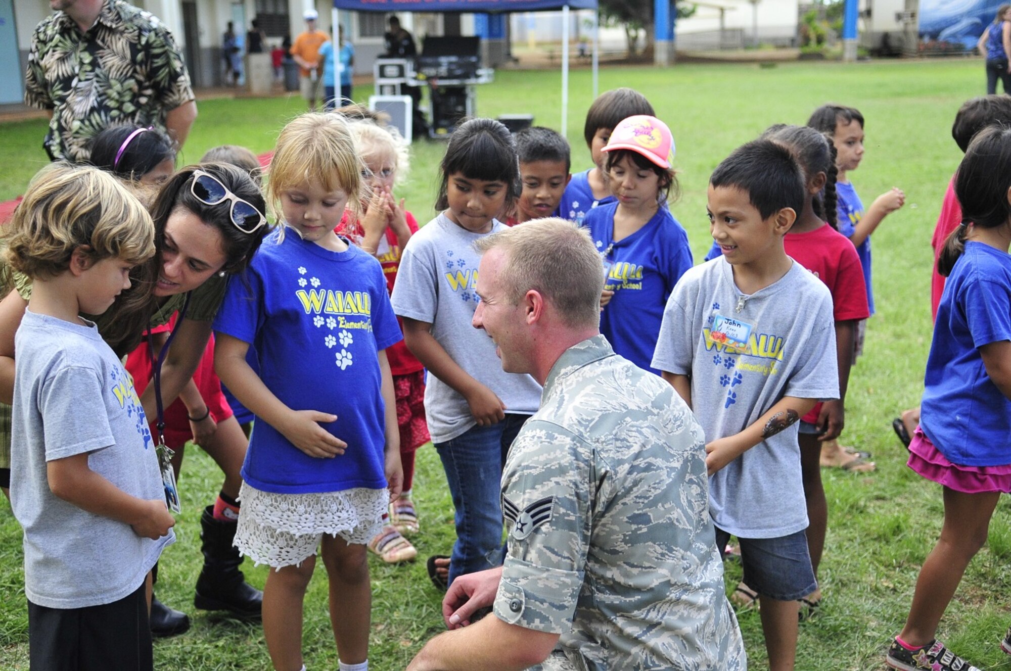 WAILUA, Hawaii -- The Band of the Pacific-Hawaii's rock band, Hana Hou, performed for a thousand elementary children at Wailua Elementary, October 22, 2013. SrA Aaron Kusterer, Band of the Pacific-Hawaii guitarist, talked with students after show. The performance was part of a community relations outreach initiative, supporting in part the Red Ribbon Week anti-drug initiative. (US Air Force Photo/SSgt Courtney Clifford/released)