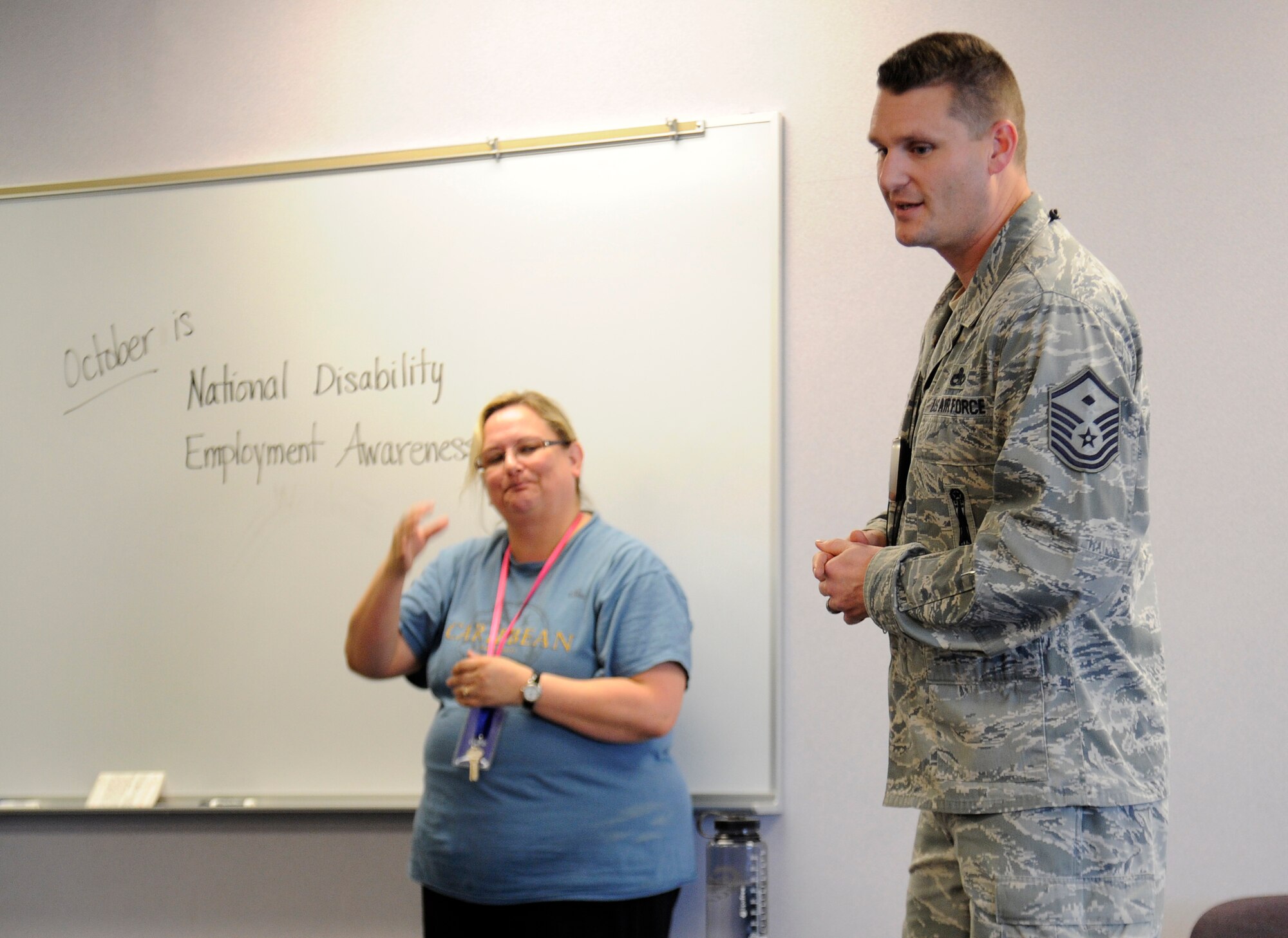 Master Sgt. Shawn Bergman, 66th Training Squadron first sergeant, speaks with Michael Anderson Elementary School students about National Disability Employment Awareness Month at Fairchild Air Force Base, Wash., Oct. 25, 2013. Bergman told stories from his past that children can relate to and help them overcome issues in their lives. (U.S. Air Force photo by Airman 1st Class Ryan Zeski/Released)