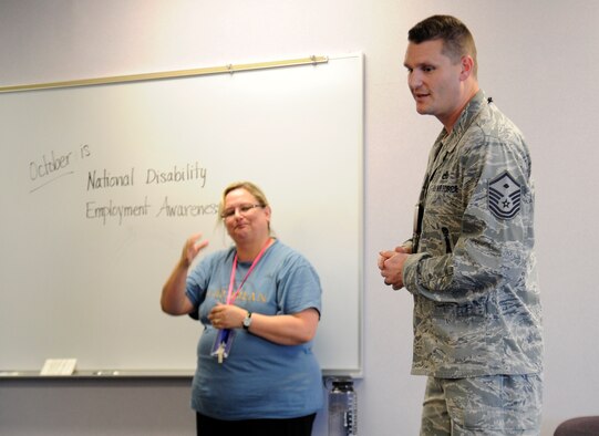 Master Sgt. Shawn Bergman, 66th Training Squadron first sergeant, speaks with Michael Anderson Elementary School students about National Disability Employment Awareness Month at Fairchild Air Force Base, Wash., Oct. 25, 2013. Bergman told stories from his past that children can relate to and help them overcome issues in their lives. (U.S. Air Force photo by Airman 1st Class Ryan Zeski/Released)