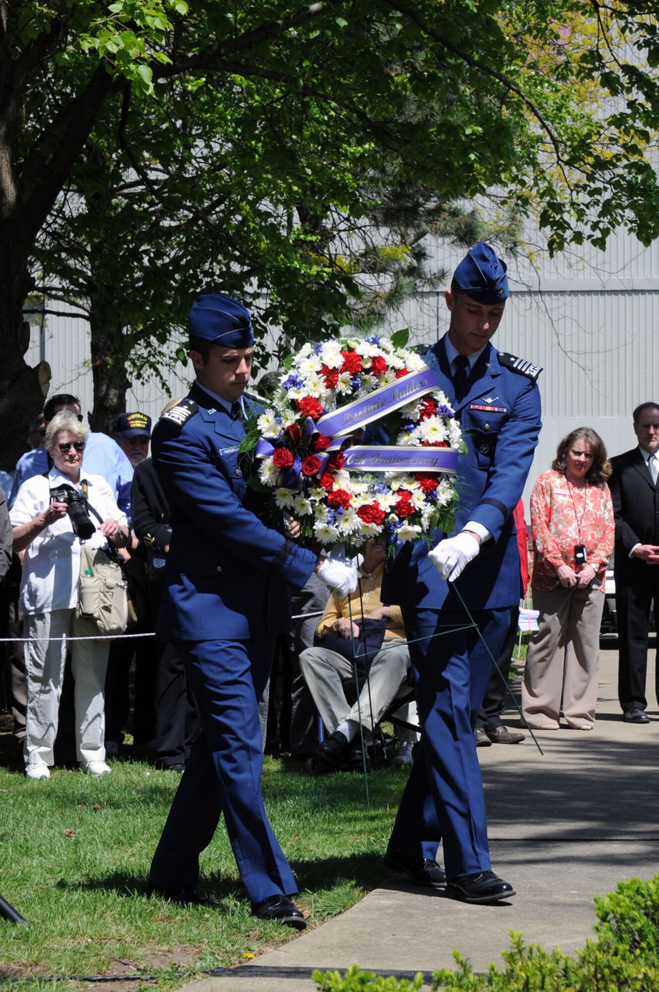 Two cadets from the Air Force Academy present a wreath during a memorial service in honor of the Doolittle Raiders 70th Anniversary Reunion in 2012.  Public activities for the Final Toast on Nov. 9 will include a wreath-laying ceremony in Memorial Park, followed by B-25 flyover. (U.S. Air Force photo/Jeff Fisher)