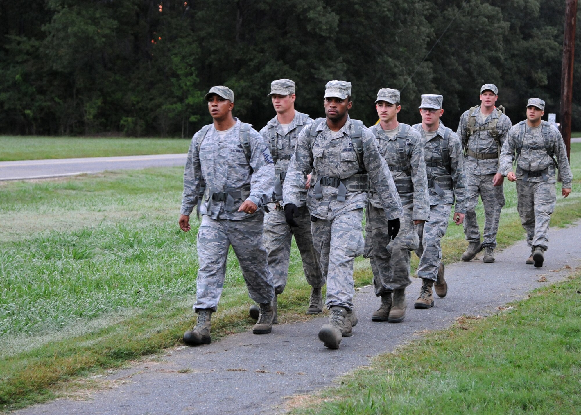 Airmen from the 2nd Civil Engineer Squadron ruck march on Barksdale Air Force Base, La., Oct. 21, 2013. Over 90 Airmen participated in the 3 mile ruck which involved carrying a minimum of 20 pounds.  2nd CES strives to improve Airmen fitness by performing alternative workouts similar to a deployed environment. (U.S. Air Force photo/Senior Airman Joseph A. Pagán Jr.)