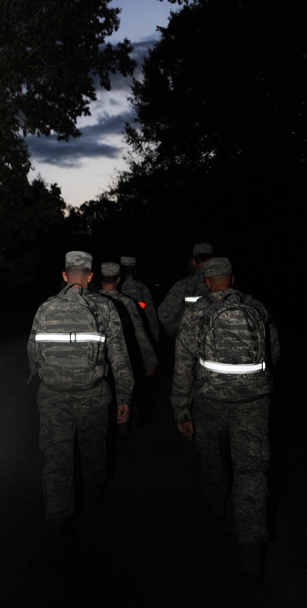Airmen from the 2nd Civil Engineer Squadron march in formation on Barksdale Air Force Base, La., Oct. 21, 2013. As an alternative to physical training exercises, once a month, 2nd CES Airmen do a PT session involving workouts similar to what one might expect during a deployment. This day involved rucking for 3 miles while carrying 20 pounds.  (U.S. Air Force photo/Senior Airman Joseph A. Pagán Jr.)