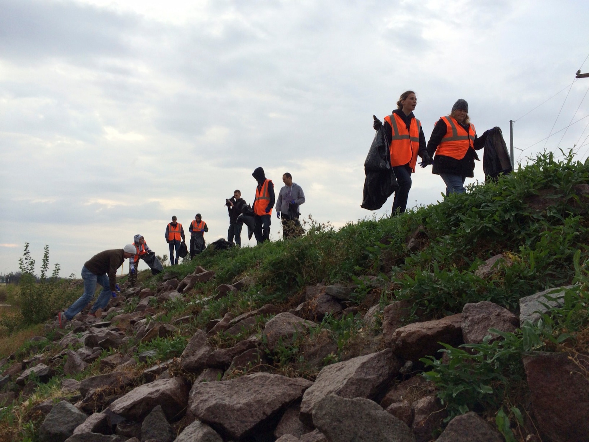ALTUS AIR FORCE BASE, Okla. – Volunteers walk along the road outside of Altus AFB Oct. 26, 2013. More than 75 volunteers attended Clean Up Altus, despite rain and cold winds. (U.S. Air Force photo by Staff Sgt. Nathanael Callon/Released)