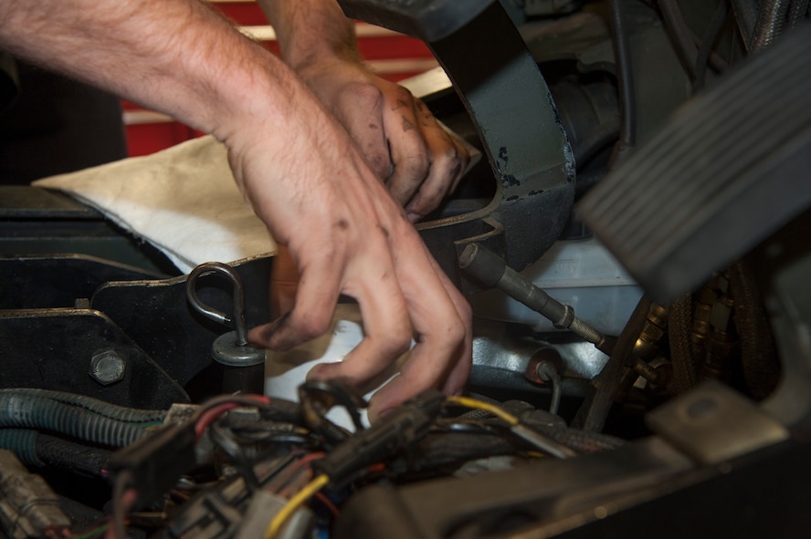 U.S. Air Force Staff Sgt. Tyler Craig, 23d Logistics Readiness Squadron mechanical analyst technician journeyman, replaces an oil filter in a government forklift at Moody Air Force Base, Ga., Oct. 28, 2013. Craig attended Air Force technical training at Port Hueneme, Calif., before arriving at Moody in 2008. (U.S. Air Force photo by Airman Dillian Bamman/Released)