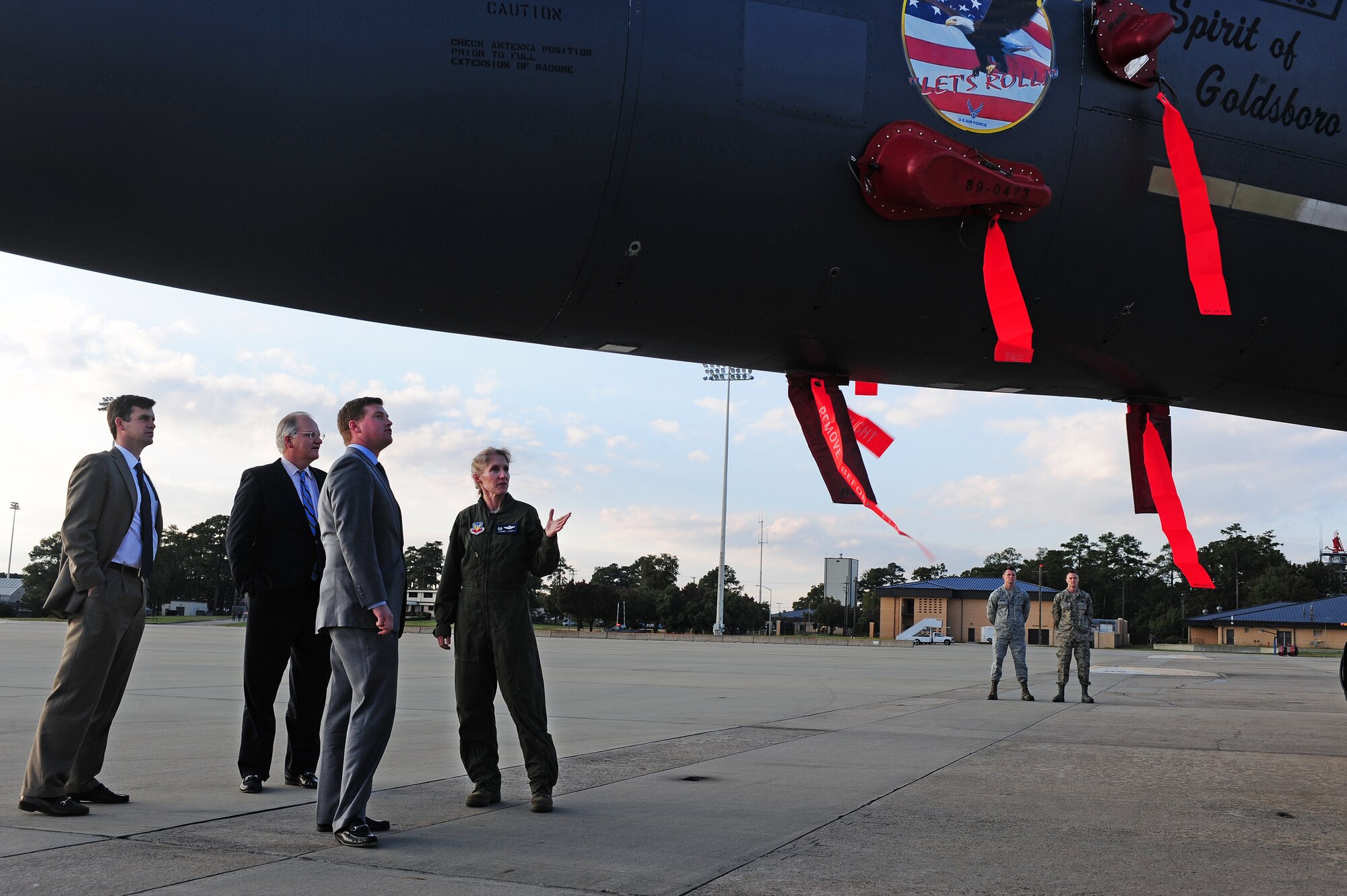 U.S. Air Force Col. Jeannie Leavitt, 4th Fighter Wing commander, discusses the capabilities of an F-15E Strike Eagle aircraft with members of the North Carolina State Legislature during a tour at Seymour Johnson Air Force Base, N.C., Oct. 24, 2013. The tour briefly stopped at the flight line to observe and learn about the Strike Eagle and KC-135R Stratotanker. (U.S. Air Force photo by Airman 1st Class John Nieves Camacho)