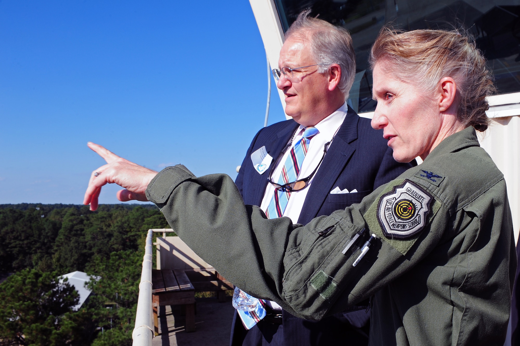 U.S. Air Force Col. Jeannie Leavitt, 4th Fighter Wing commander, talks to James Kerr, North Carolina State Legislature member, about the area surrounding the air traffic control tower during a tour at Seymour Johnson Air Force Base, N.C., Oct. 24, 2013. Leavitt refers to the view from the tower as “The best view of Wayne County.”  (U.S. Air Force photo by Airman 1st Class John Nieves Camacho)