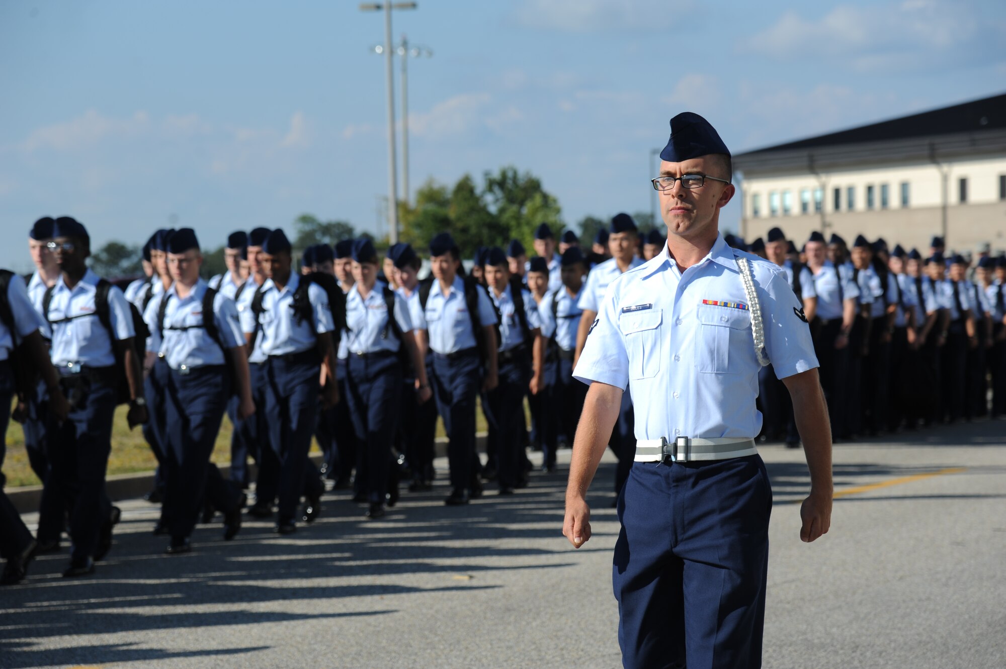 Airman Jared Boles, 335th Training Squadron, marches troops from Wolfe Hall to the triangle area Oct. 28, 2013, Keesler Air Force Base, Miss.  He is the 81st Training Group’s Airman of the Month for September.  Boles, from Roseville, Calif., is currently training in the weather apprentice course.  The four squadrons that train nonprior service students each select one Airman to compete at a monthly group board. The Airmen respond to questions about customs and courtesies, dress and appearance, enlisted force development and current events from that week’s issue of the Keesler News. (U.S. Air Force photo by Kemberly Groue)