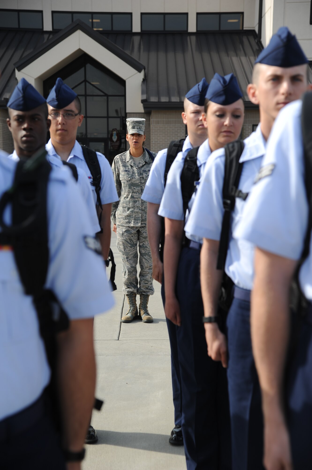 Staff Sgt. Vallerie Barnes, 334th Training Squadron, prepares her Airmen to march from Avery Manor to the Levitow Training Support Facility for in-processing Oct. 29, 2013, at Keesler Air Force Base, Miss.  Barnes won the Dragon Award for outstanding military training leader for September. One MTL is nominated from each of the four squadrons that train non-prior service students. Nominees take a knowledge test of the Air Force Instruction that governs the MTL job and perform control of flight marching and open ranks. The award is intended to raise the level of adherence to military training standards and military excellence set for technical training students.  (U.S. Air Force photo by Kemberly Groue)