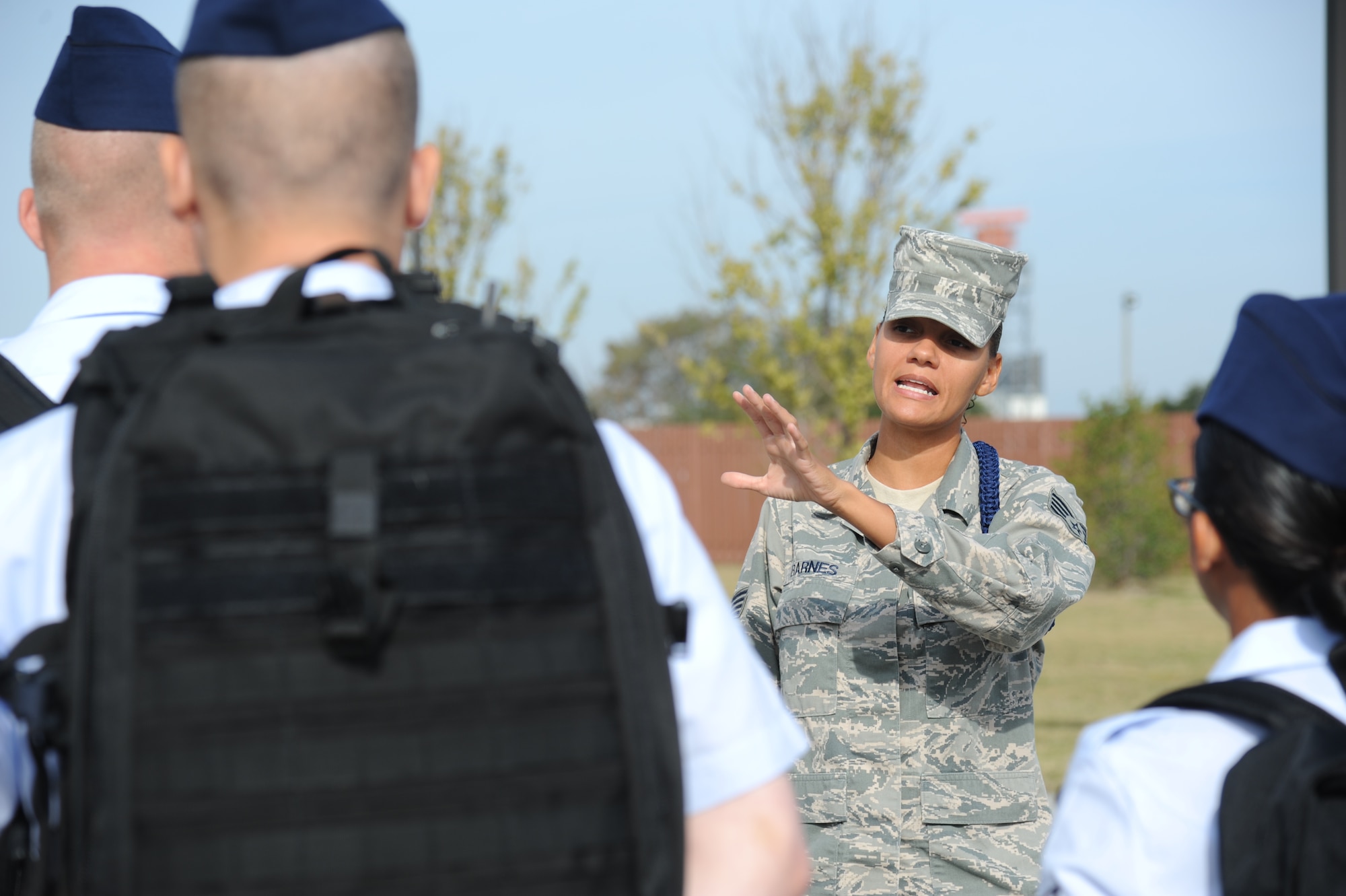 Staff Sgt. Vallerie Barnes, 334th Training Squadron, briefs her Airmen as they prepare to march from Avery Manor to the Levitow Training Support Facility for in-processing Oct. 29, 2013, at Keesler Air Force Base, Miss.  Barnes won the Dragon Award for outstanding military training leader for September. One MTL is nominated from each of the four squadrons that train non-prior service students. Nominees take a knowledge test of the Air Force Instruction that governs the MTL job and perform control of flight marching and open ranks. The award is intended to raise the level of adherence to military training standards and military excellence set for technical training students.  (U.S. Air Force photo by Kemberly Groue)
