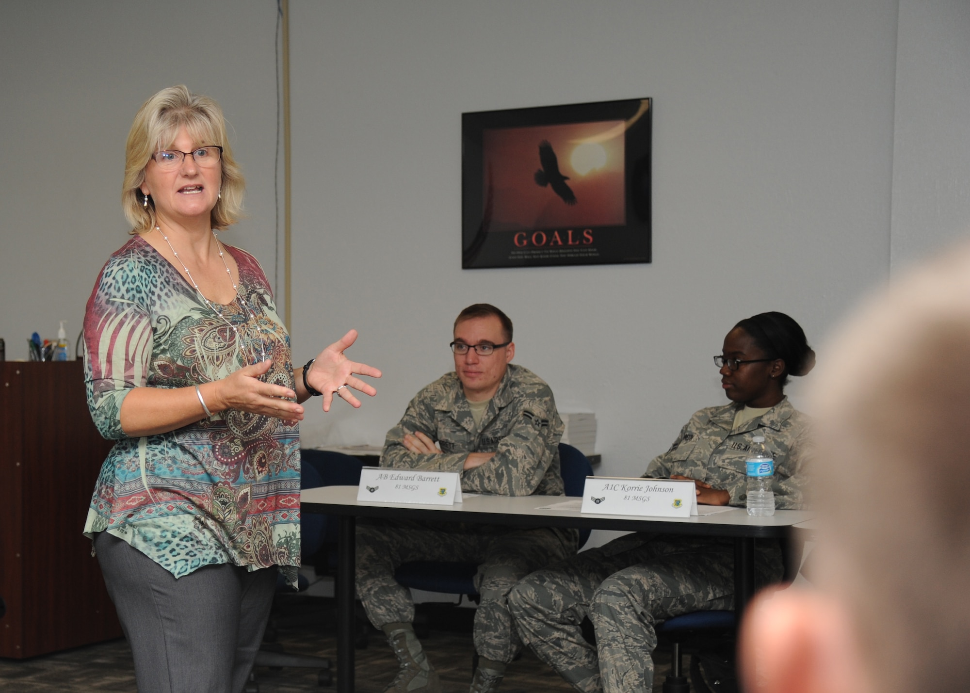 Elizabeth Waters, 81st Training Wing community service coordinator, speaks to Airmen attending the First Term Airman Center program on resiliency Oct. 29, 2013, at the Professional Development building, Keesler Air Force Base, Miss.  Waters emphasizes resilience through the four pillars of comprehensive Airman fitness -- physical, mental, social and spiritual strength.  (U.S. Air Force photo by Kemberly Groue)
