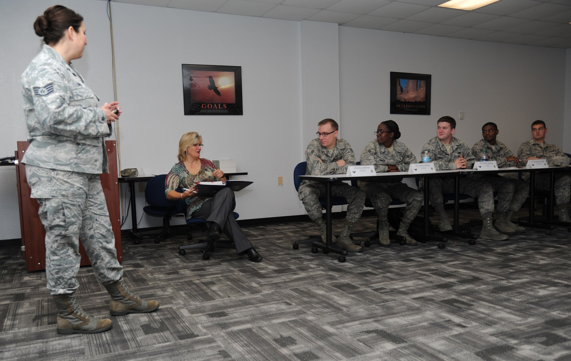 Staff Sgt. Sarah Owens, 81st Logistics Readiness Squadron and master resilience trainer, is being observed by Elizabeth Waters, 81st Training Wing community service coordinator, as she briefs Airmen attending the First Term Airman Center program on resiliency Oct. 29, 2013, at the Professional Development building, Keesler Air Force Base, Miss.  Waters emphasizes resilience through the four pillars of comprehensive Airman fitness -- physical, mental, social and spiritual strength.  (U.S. Air Force photo by Kemberly Groue)