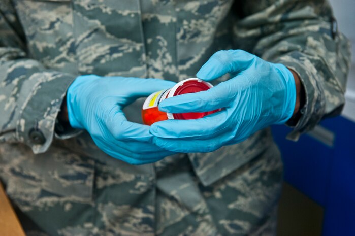 Staff Sgt. Nakeisha Alexander, 99th Medical Support Squadron pharmacy technician, prepares expired medication for disposal at the Exchange Oct. 25, 2013, at Nellis Air Force Base, Nev. Unused and expired medications were turned in for proper disposition by the Air Force Office of Special Investigations detachment on Nellis AFB and the Las Vegas Drug Enforcement Agency. It is mandatory for expired medications to be disposed of every six months. (U.S. Air Force photo/Senior Airman Brett Clashman)