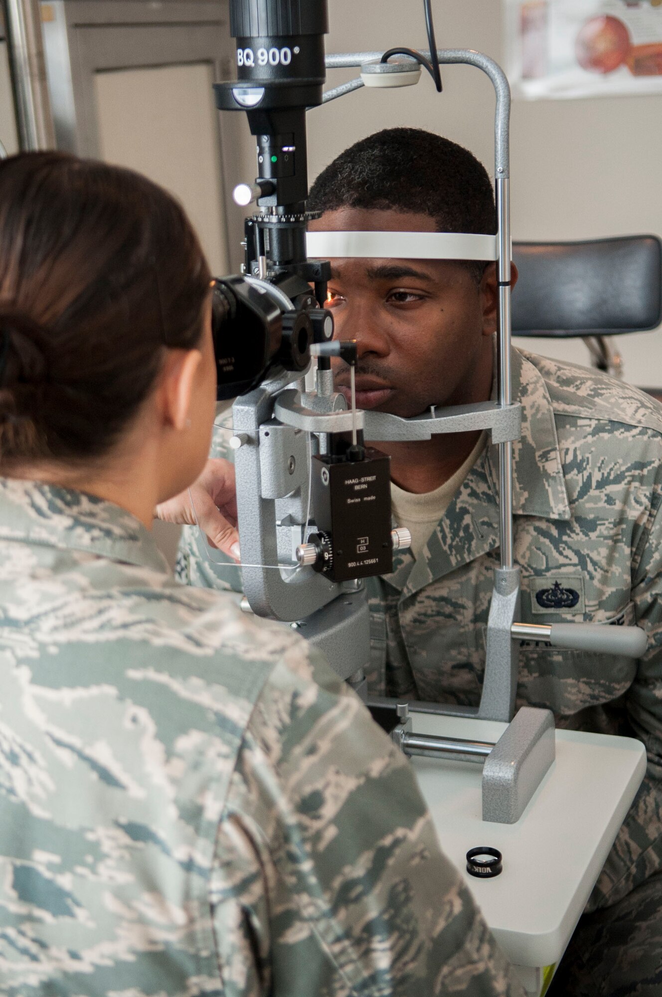 U.S. Air Force Capt. Kaylaen Dittmer, 23d Medical Group optometrist, uses a slit lamp to evaluate a patient’s eyes at Moody Air Force Base, Oct. 22, 2013. Slit lamps give the optometrist a magnified view of the internal and external portions of the eye. (U.S. Air Force photo by Airman  1st Class Sandra Marrero/Released)
