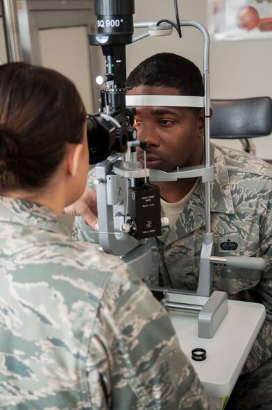 U.S. Air Force Capt. Kaylaen Dittmer, 23d Medical Group optometrist, uses a slit lamp to evaluate a patient’s eyes at Moody Air Force Base, Oct. 22, 2013. Slit lamps give the optometrist a magnified view of the internal and external portions of the eye. (U.S. Air Force photo by Airman  1st Class Sandra Marrero/Released)
