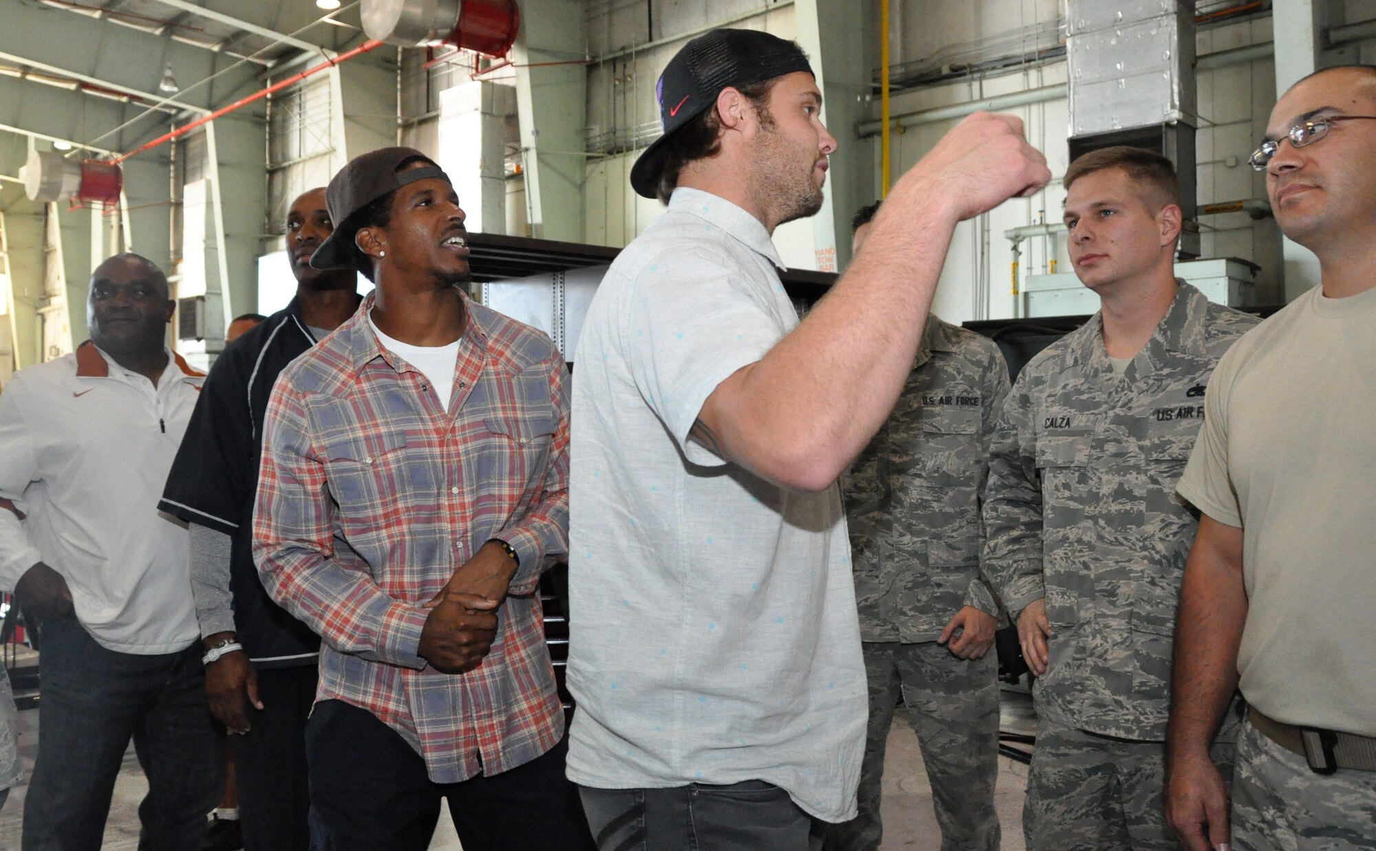 Four former National Football League members took time out to visit with 301st Fighter Wing members Oct. 22 just days before they are to deploy to Southwest Asia. Seen from left to right are James Gray, New England Patriots, Byron Williams, NY Giants, Justin King and David Vabora, both from the St. Louis Rams. (U.S. Air Force photo/MSgt. Julie Briden-Garcia)