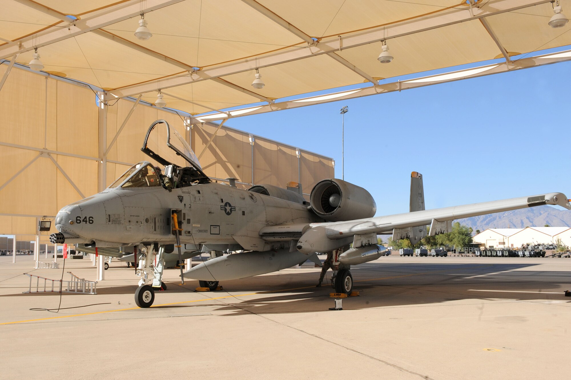 A U.S. Air Force A-10 Thunderbolt II sits beneath a sunshade at Davis-Monthan Air Force Base, Ariz., Oct. 25, 2013. Five A-10s were flown here from Spangdahlem Air Base, Germany, after the 81st Fighter Squadron there was inactivated. The squadron was closed in support of force-shaping procedures across the service. (U.S. Air Force photo by Airman 1st Class Saphfire Cook/Released) (cropped)