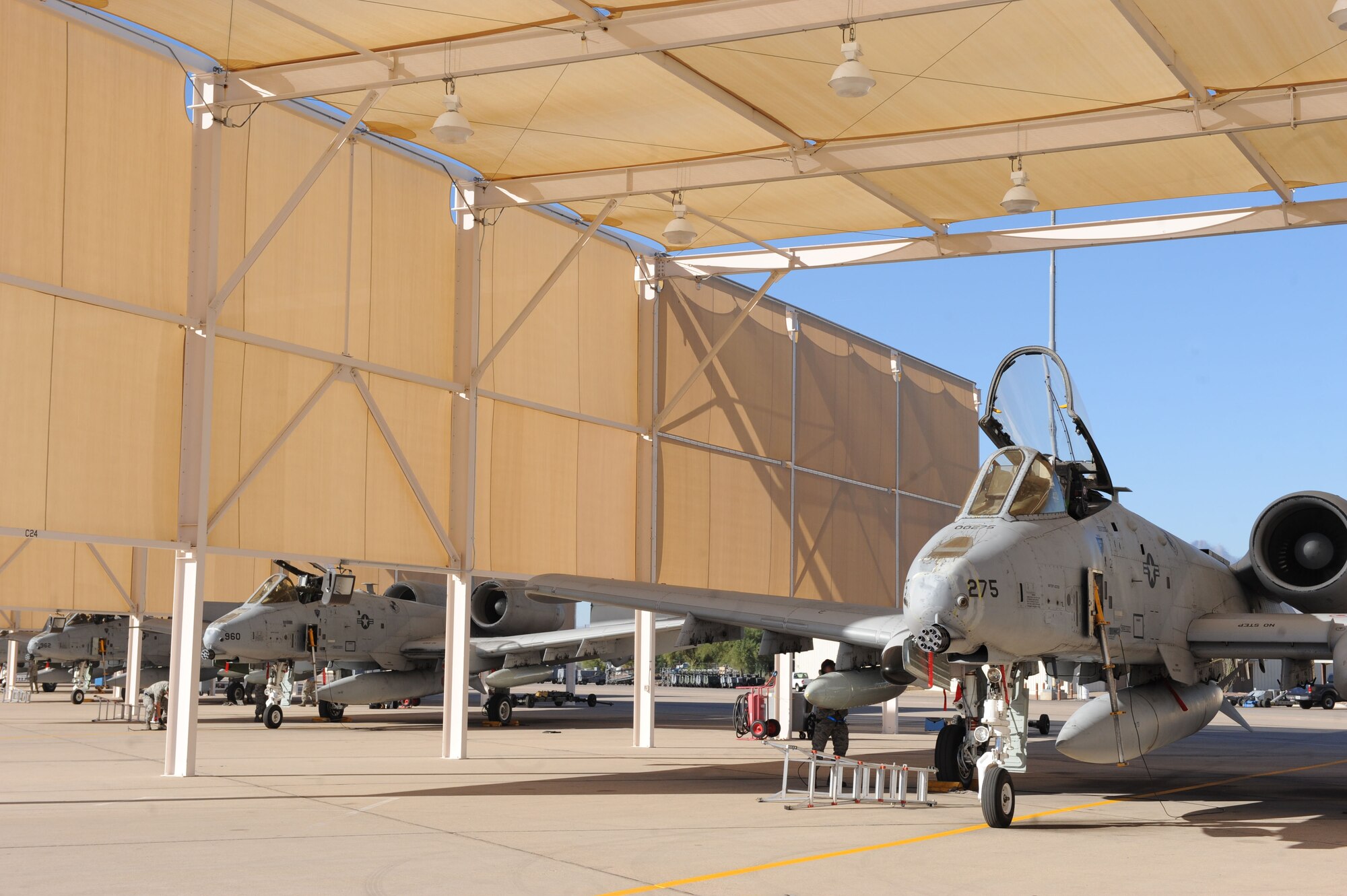 U.S. Air Force A-10 Thunderbolt II aircraft sit beneath sunshades at Davis-Monthan Air Force Base, Ariz., Oct. 25, 2013. The five A-10s were flown in from Spangdahlem Air Base, Germany, as replacements for older planes that were being sent to the 355th Aircraft Maintenance and Regeneration Group for retirement. This is the second aircraft replenishing effort done here at D-M this year. (U.S. Air Force photo by Airman 1st Class Saphfire Cook/Released) (cropped)