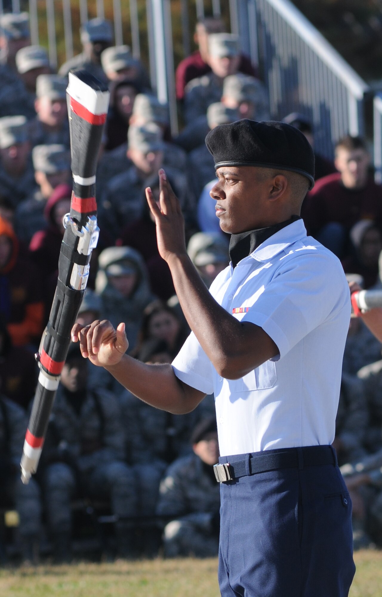 Airman Basic Jeremiah Cortes, 335th Training Squadron spins a rifle during the 81st Training Group drill down competition Oct. 25, 2013, at the Levitow Training Support Facility, Keesler Air Force Base, Miss. The 335th TRS took first place in freestyle and second place in open ranks, regulation and overall.  (U.S. Air Force photo by Kemberly Groue)