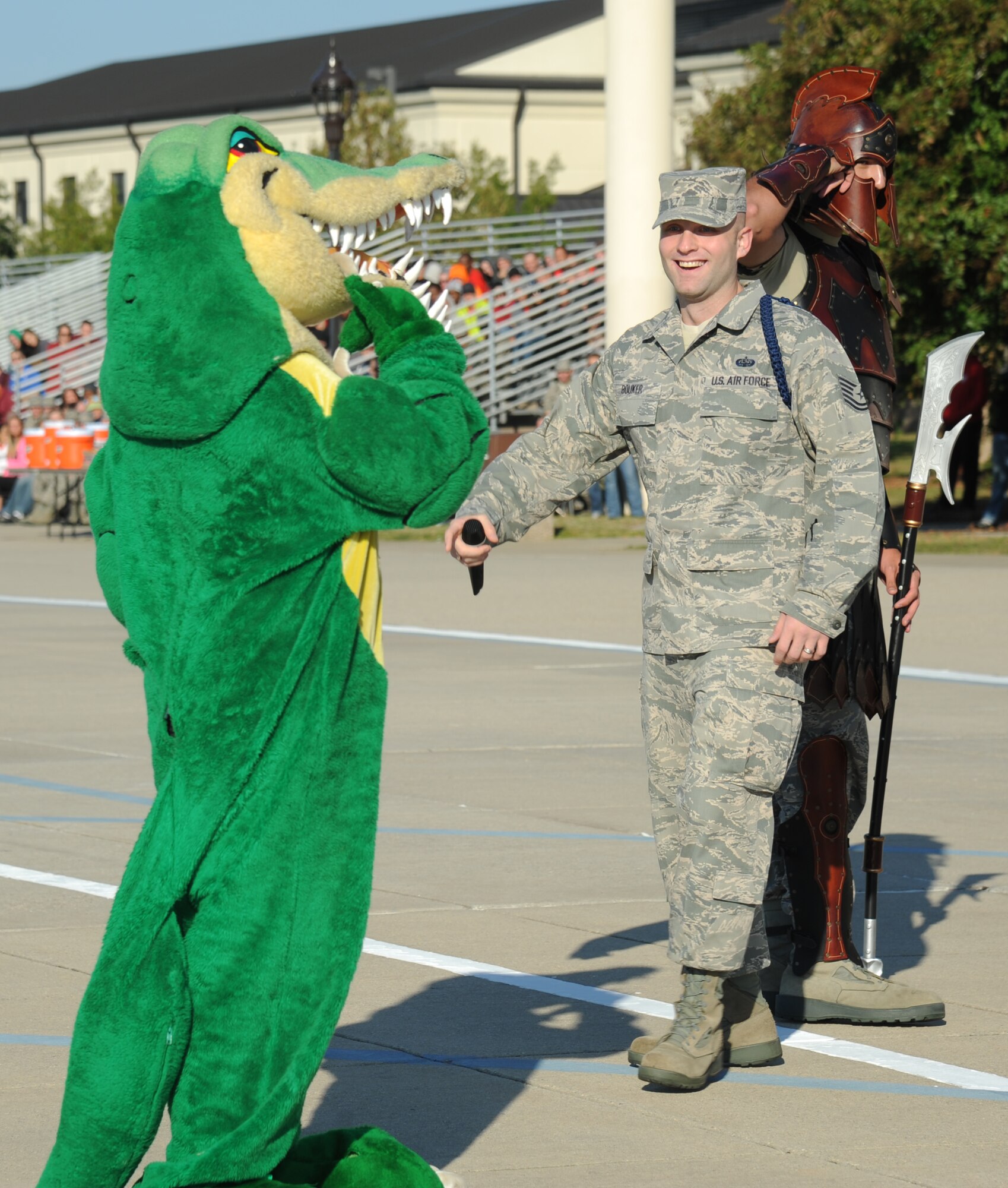 Tech. Sgt. Christopher Bouker, 334th Training Squadron, leads the mascots in a game of Simon Says during the 81st Training Group drill down competition Oct. 25, 2013, at the Levitow Training Support Facility, Keesler Air Force Base, Miss.  The 334th TRS Gators won the game.  (U.S. Air Force photo by Kemberly Groue)