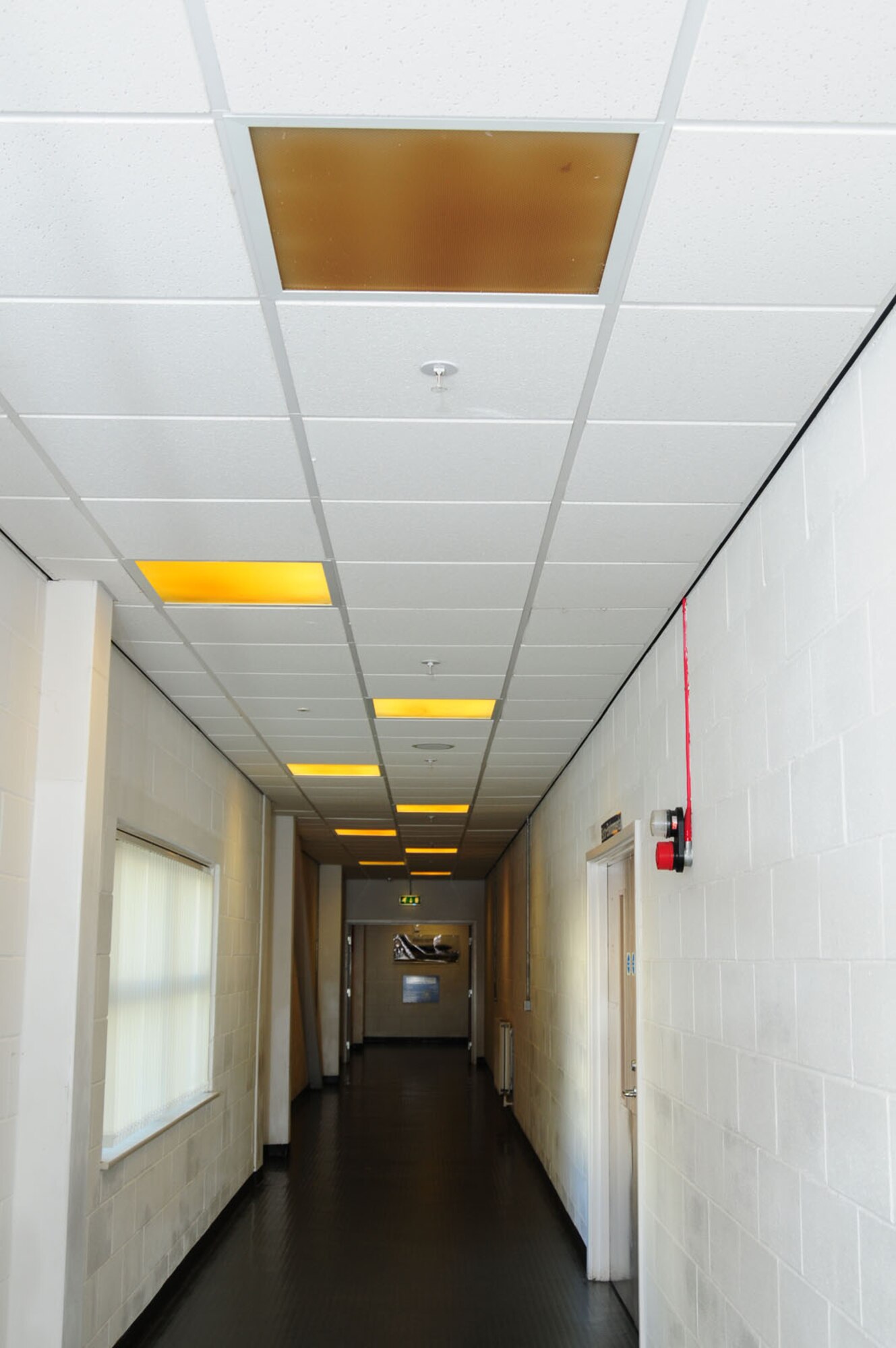 Stained and non-working light diffusers on RAF Mildenhall, England, waste energy and should be identified and replaced. Facility managers and other people can help manage and reduce energy usage by ensuring lights are turned off when not in use. Installing motion-sensor lighting in facilities is one way to reduce costs and conserve energy. (U.S. Air Force photo by Karen Abeyasekere/Released) 