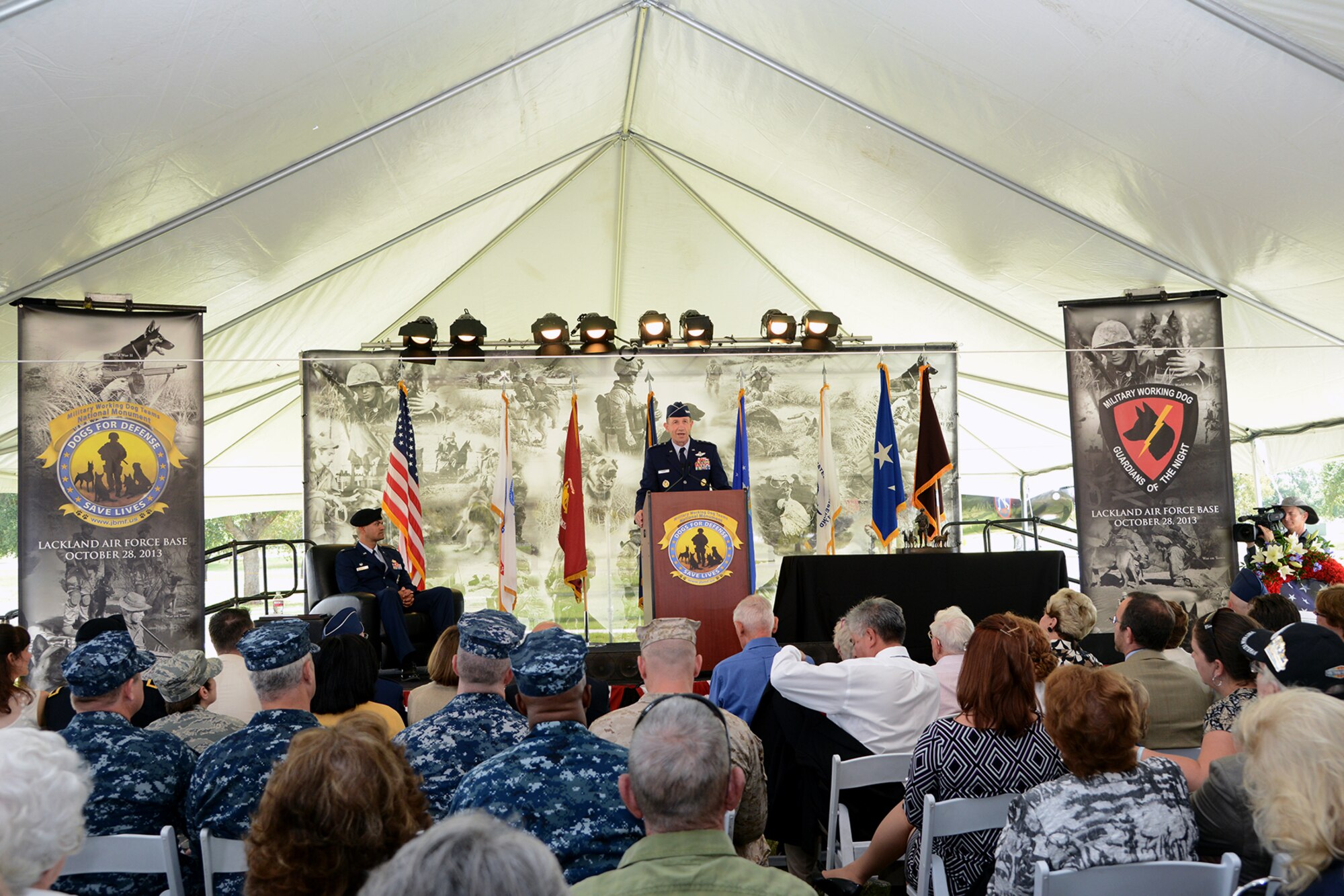 JOINT BASE SAN ANTONIO-LACKLAND, Texas --Lt. Gen. James Holmes Vice Commander, Air Education and Training Command, Joint Base San Antonio-Randolph, speaks at the U.S. Military Working Dog Teams National Monument dedication ceremony Oct. 28 at Joint Base San Antonio-Lackland. JBSA-Lackland is the home to the Department of Defense Military Working Dog Program and is where the U.S. Armed Forces has been training its military working dog teams since 1958. It is the world's largest training center for military dogs and handlers and is also home to the largest veterinary hospital for military working dogs.(U.S. Air Force photo by Ben Faske)
