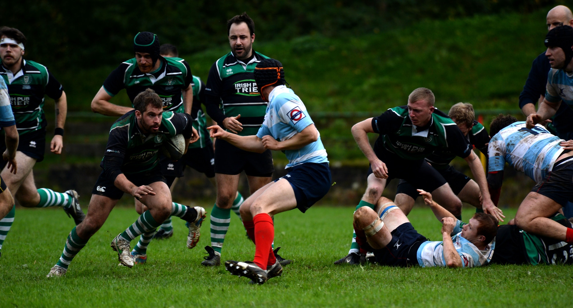 SPANGDAHLEM AIR BASE, Germany--Elliot Curtis, a 52nd Force Support Squadron Eifel Arms Inn shuttle driver from Fort Walton Beach, Fla., runs during a rugby game at the University of Trier Rugby Pitch Oct. 12, 2013. The University of Trier Rugby team won the championship for the region liga three times out of the last five years. (U.S. Air Force photo by Senior Airman Rusty Frank/Released)