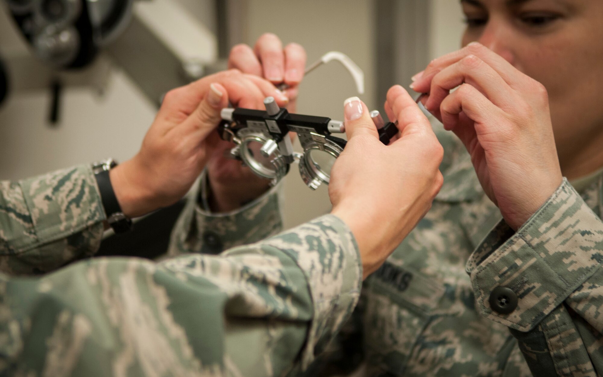 A patient tries on a pair of trial frames at Moody Air Force Base, Oct. 22, 2013. Employees at Moody’s optometry clinic order about 2,800 pairs of eyewear annually, including gas mask inserts and ballistic eyewear. 
(U.S. Air Force photo by Airman 1st Class Sandra Marrero/Released)
