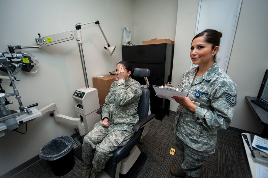 U.S. Air Force Tech. Sgt. Crystal Foster, 23d Medical Group optometry technician, takes the visual acuity of Staff Sgt. Teranyeli Brook, 23d Medical Group NCO in charge of command support staff, Oct 22., 2013 at Moody Air Force Base, Ga. A visual acuity test measures clarity of vision and is used to determine if a patient requires corrective lenses. (U.S. Air Force photo by Airman 1st Class Sandra Marrero/Released)
