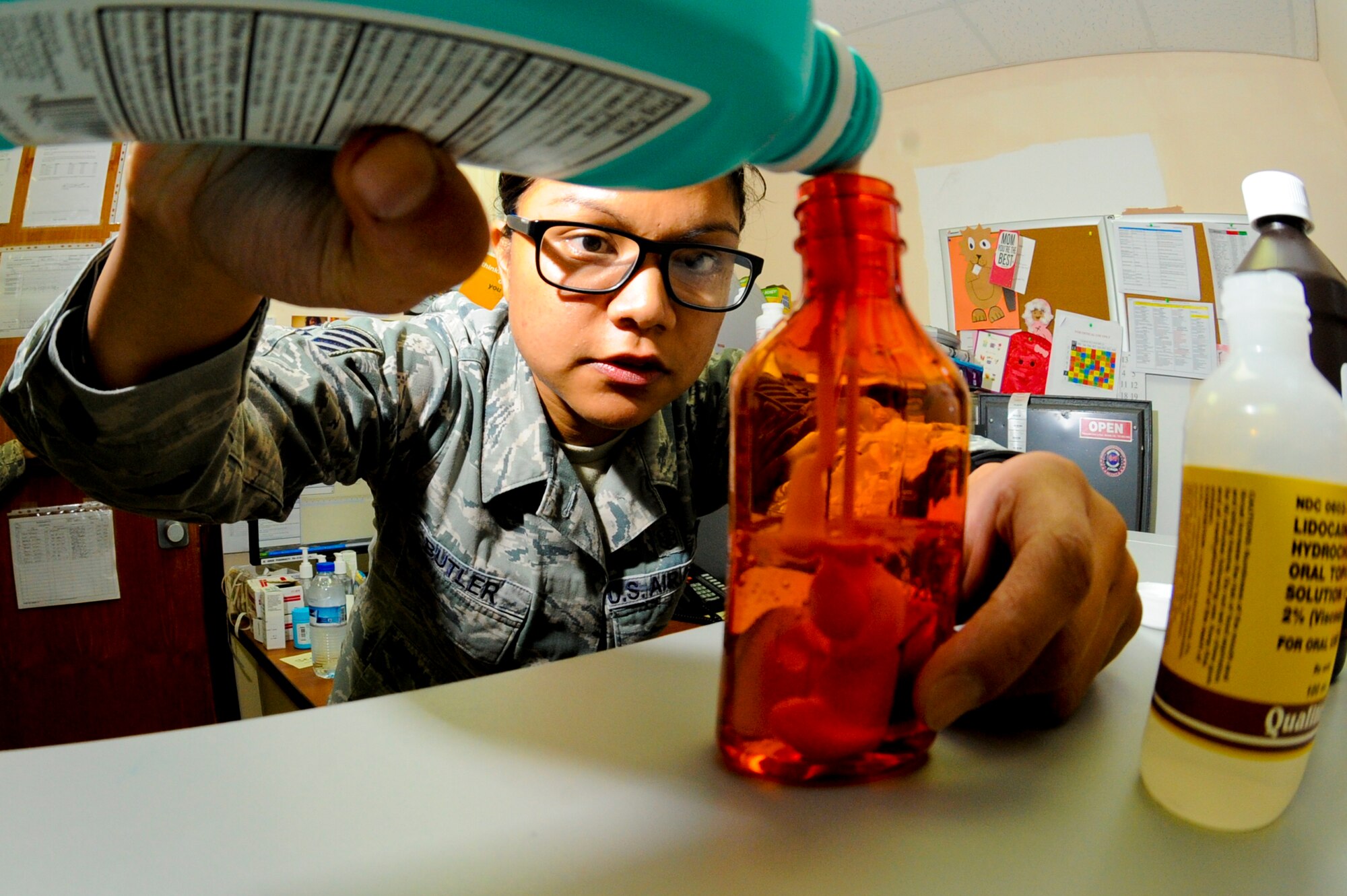 U.S. Air Force Tech. Sgt. Kristine Butler, 380th Expeditionary Medical Group NCO in charge of pharmacy operations, makes “Purple Butter Milk,” at an undisclosed location in Southwest Asia Oct. 22, 2013. Purple Butter Milk is a compound medication used to help an upset stomach. Butler is native to Union City, Calif., and is deployed from Joint Base Langley-Eustis, Va. (U.S. Air Force photo by Staff Sgt. Joshua J. Garcia)