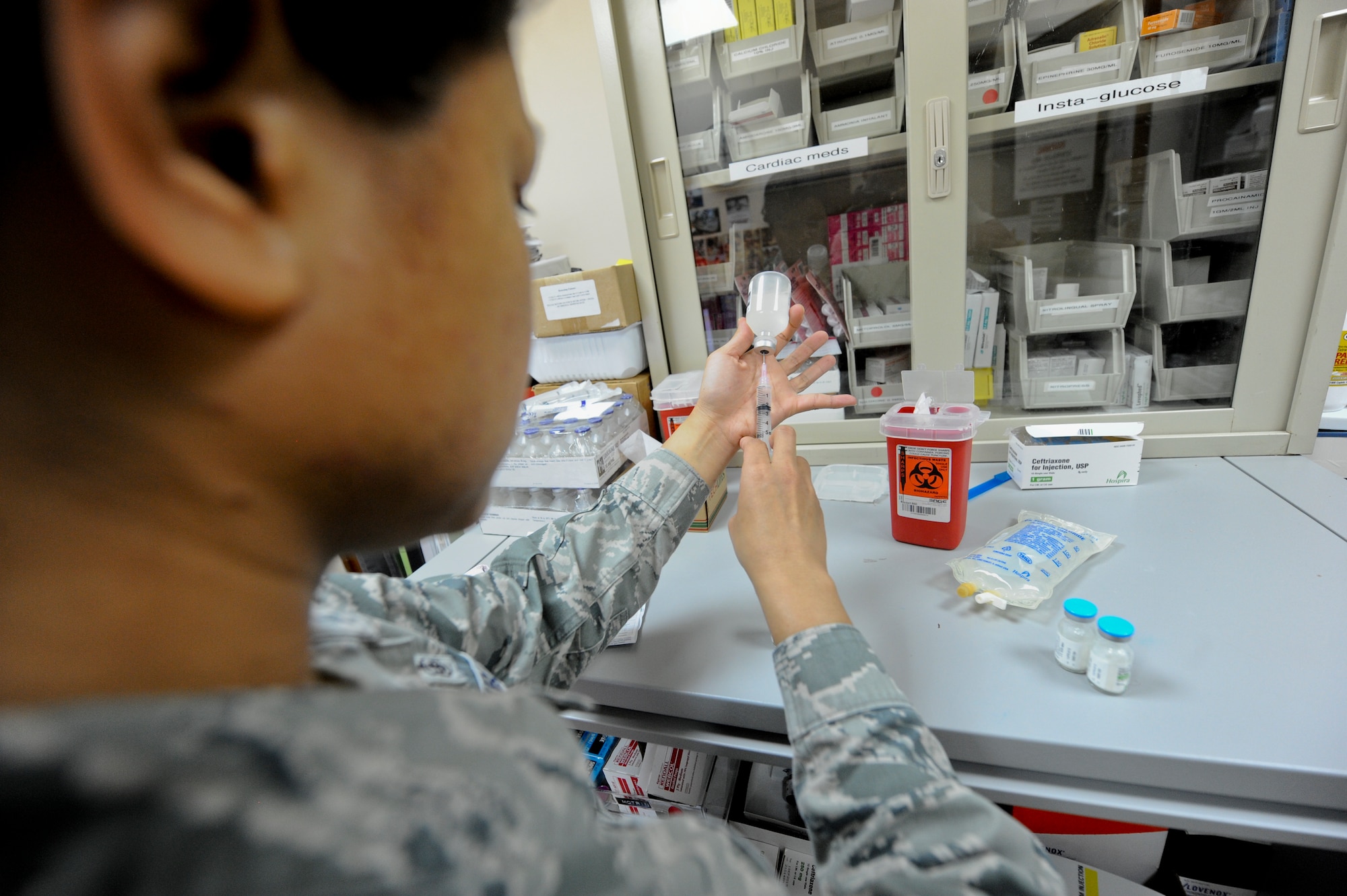 U.S. Air Force Tech. Sgt. Kristine Butler, 380th Expeditionary Medical Group NCO in charge of pharmacy operations, makes a Rocephin IV for a patient at an undisclosed location in Southwest Asia Oct. 16, 2013. Rocephin is an antibiotic used to treat a wide variety of bacterial infections, and can be given via injection or by an IV over a period of time. Butler is native to Union City, Calif., and is deployed from Joint Base Langley-Eustis, Va. (U.S. Air Force photo by Staff Sgt. Joshua J. Garcia)
