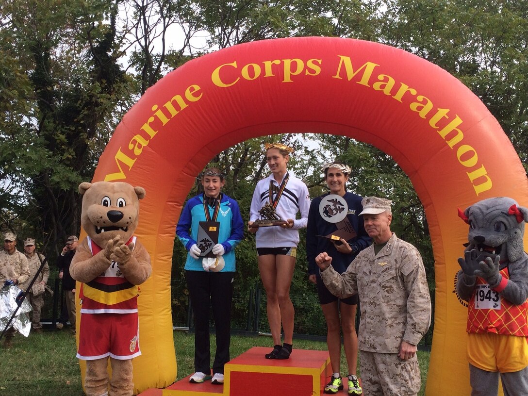 Armed Forces Runners take the overall Marine Corps Marathon top three positions:  1st- CPT Kelly Calway (Army)  Fort Carson, CO – 2:42:16; 2nd- LT Gina Slaby (Navy) JEB Virginia Beach, VA – 2:48:02; 3rd- SrA Emily Shertzer (USAF) Fort Indiantown Gap, PA – 2:48:08
