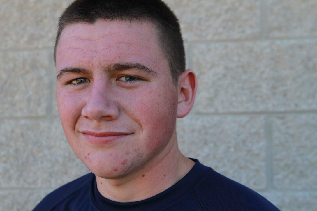 Jesse Flanagan poses for a photo during a Marine Corps pool function in Livonia, Mich., Sept. 9, 2013. Flanagan, 19, had been traveling with his parents, who are missionaries, before journeying more than 8,000 miles back home to join the Marine Corps.  (U.S. Marine Corps photo by Sgt. Elyssa Quesada/Released)