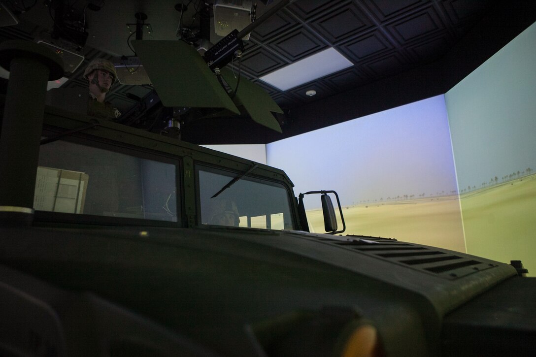 Marines with Combined Anti-Armor Team, Weapons Co., Battalion Landing Team 2nd Battalion, 4th Marines, 31st Marine Expeditionary Unit, operate a Humvee during a mission in the Combat Convoy Simulator here, Oct. 29. The CCS puts the Marines in realistic situations, using recoil simulating systems while maneuvering through a variety of scenarios in a combat zone. The $5.5 million training facility can simulate high value target extractions, security patrols, medical evacuations and calling for close-air support.  The 31st MEU is the Marine Corps’ force in readiness in the Asia-Pacific region and is the only continuously forward deployed MEU. 