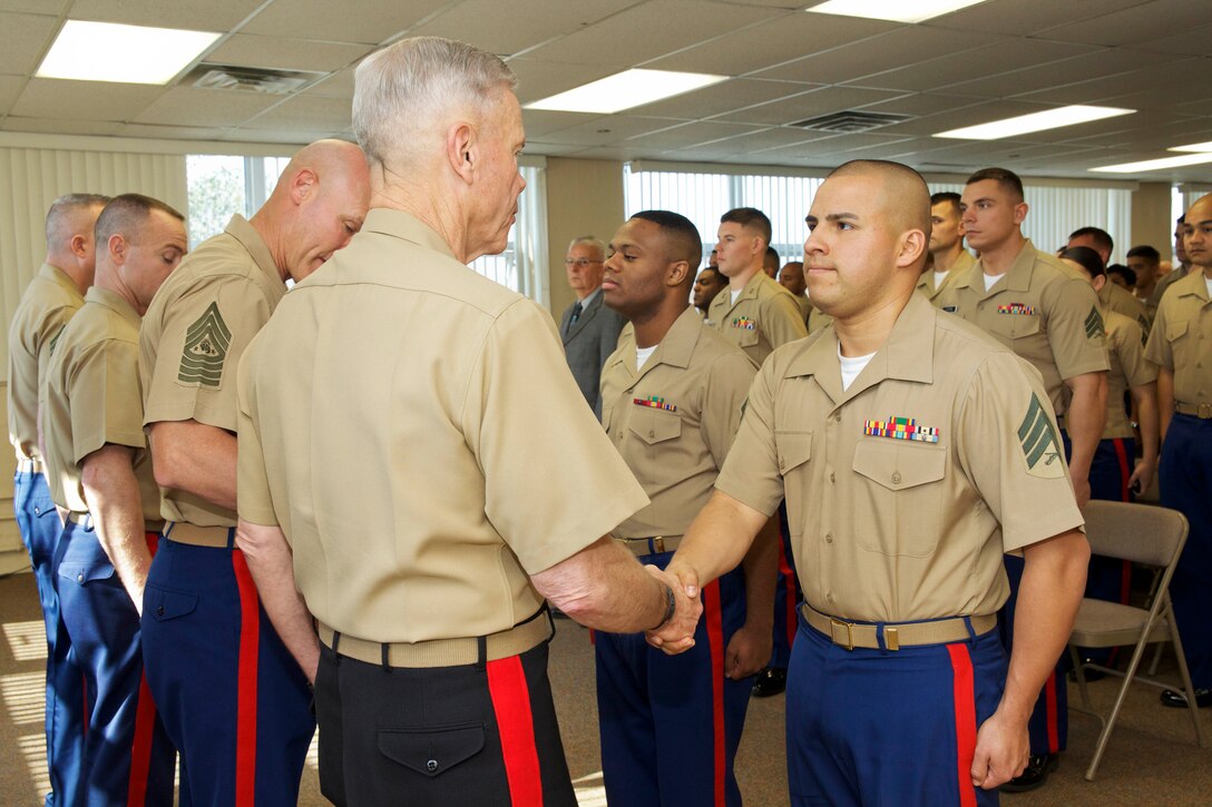 The 35th commandant of the Marine Corps, General James F. Amos, presents awards to the Marines of 1st Marine Corps District Headquarters, Marine Corps Recruiting Command, in Garden City, NY, on October 29, 2013. (U.S. Marine Corps photo by Sgt. Mallory S. VanderSchans)(RELEASED)
