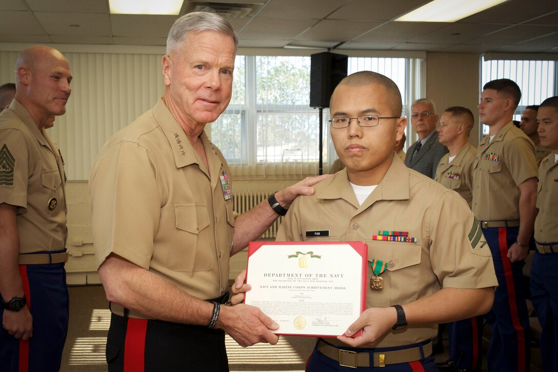 The 35th commandant of the Marine Corps, General James F. Amos, presents awards to the Marines of 1st Marine Corps District Headquarters, Marine Corps Recruiting Command, in Garden City, NY, on October 29, 2013. (U.S. Marine Corps photo by Sgt. Mallory S. VanderSchans)(RELEASED)

