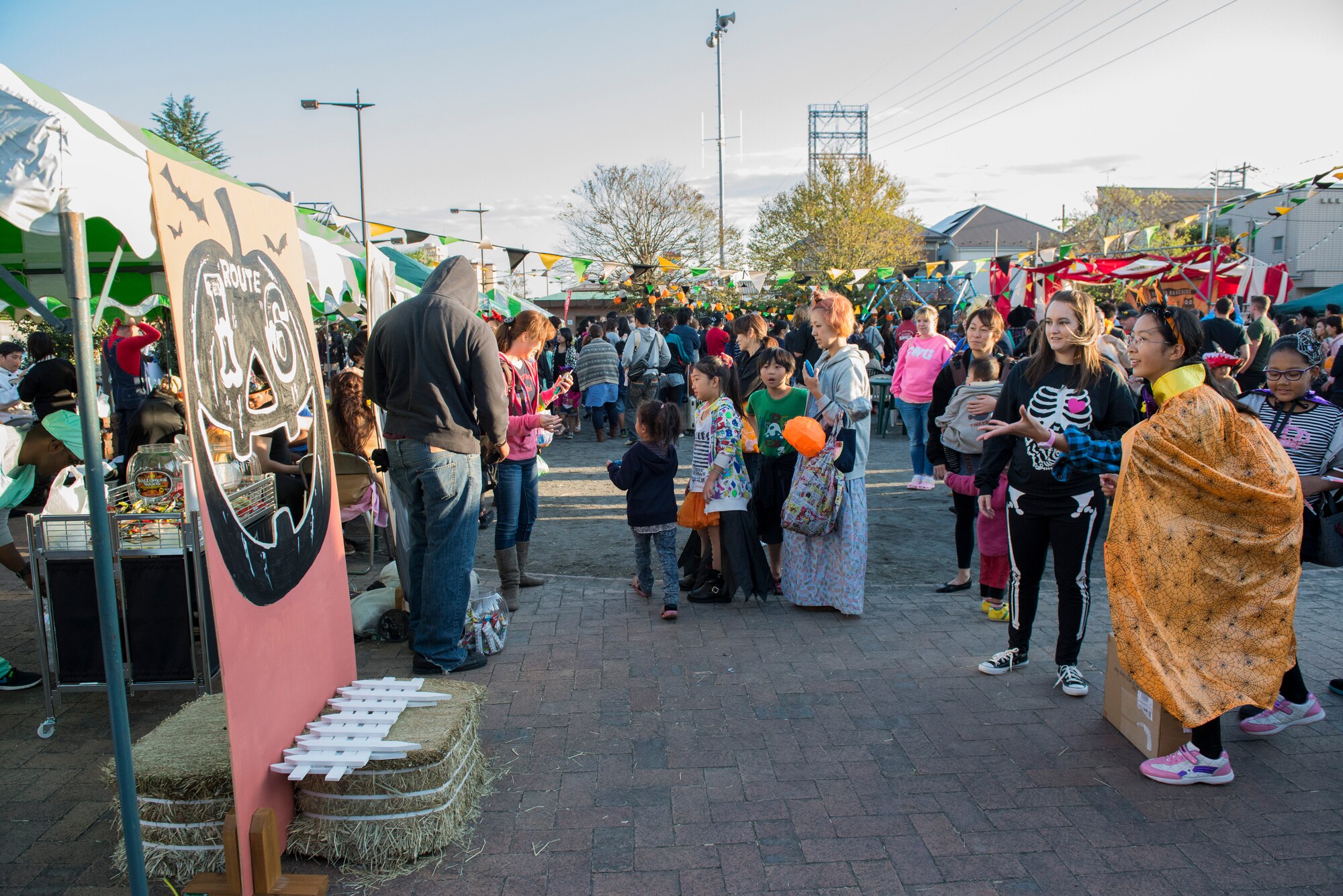 A local Japanese citizen tosses a duct-taped ball into a hallow-pumpkin mouth at Fussa, Japan, Oct. 27, 2013. The game was ran by volunteers from Yokota Air Base, Japan, who shared candy rewards to game winners. (U.S. Air Force photo by Senior Airman Cody H. Ramirez)