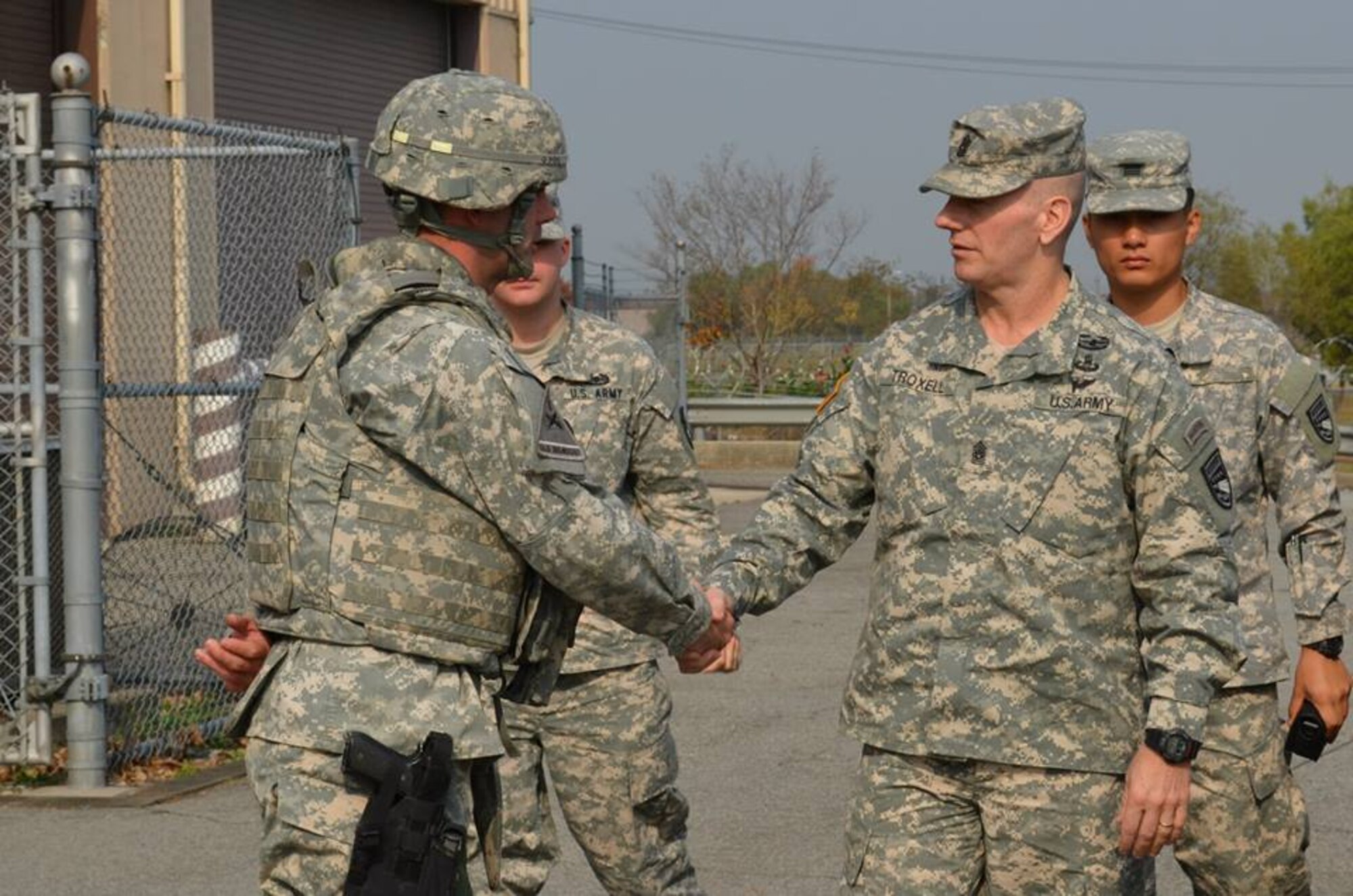 OSAN AIR BASE -- Command Sgt. Maj. John Troxell, United States Forces Korea command sergeant major, visits with Air Defenders at Battery D, 6th Battalion, 52nd Air Defense Artillery Regiment's operations site here, Oct. 24. Troxell toured the battery's facility during the 35th Air Defense Artillery Brigade's field training exercise following a briefing at the brigade headquarters. (U.S. Army Photo by Spc. Shawn Denham, PAO, 35th ADA)
