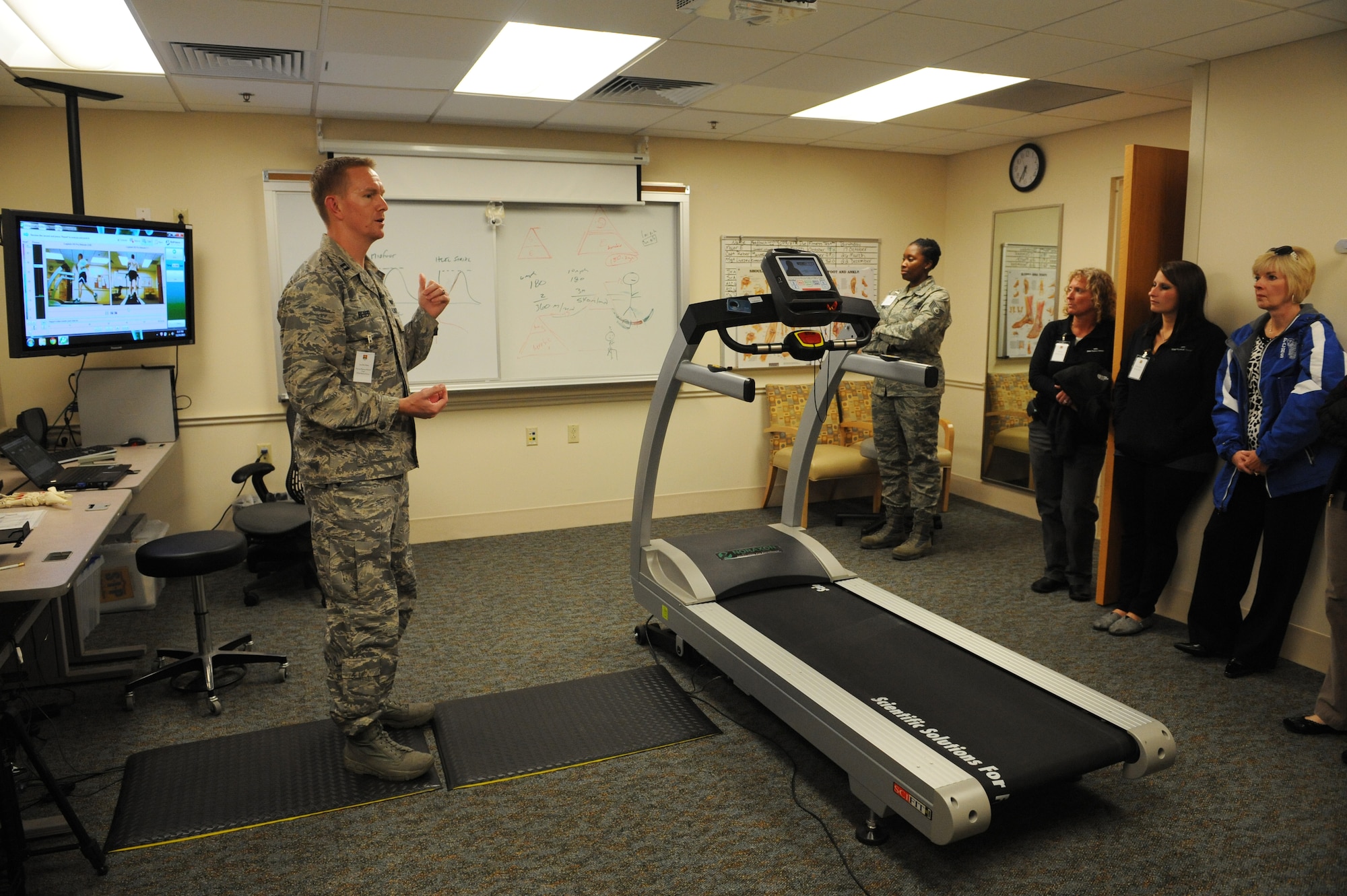 Capt. Rett Reber showcases the Gait Analysis System to a group of physical therapists during the network social at the 375th Medical Group Oct. 24.  The group also visited the laboratory, radiology, pharmacy and a family health exam room so they would understand how the clinic is ran.  Reber is the 375th MG physical therapy element chief.  (U.S. Air Force photo by Staff Sgt. Maria Bowman)