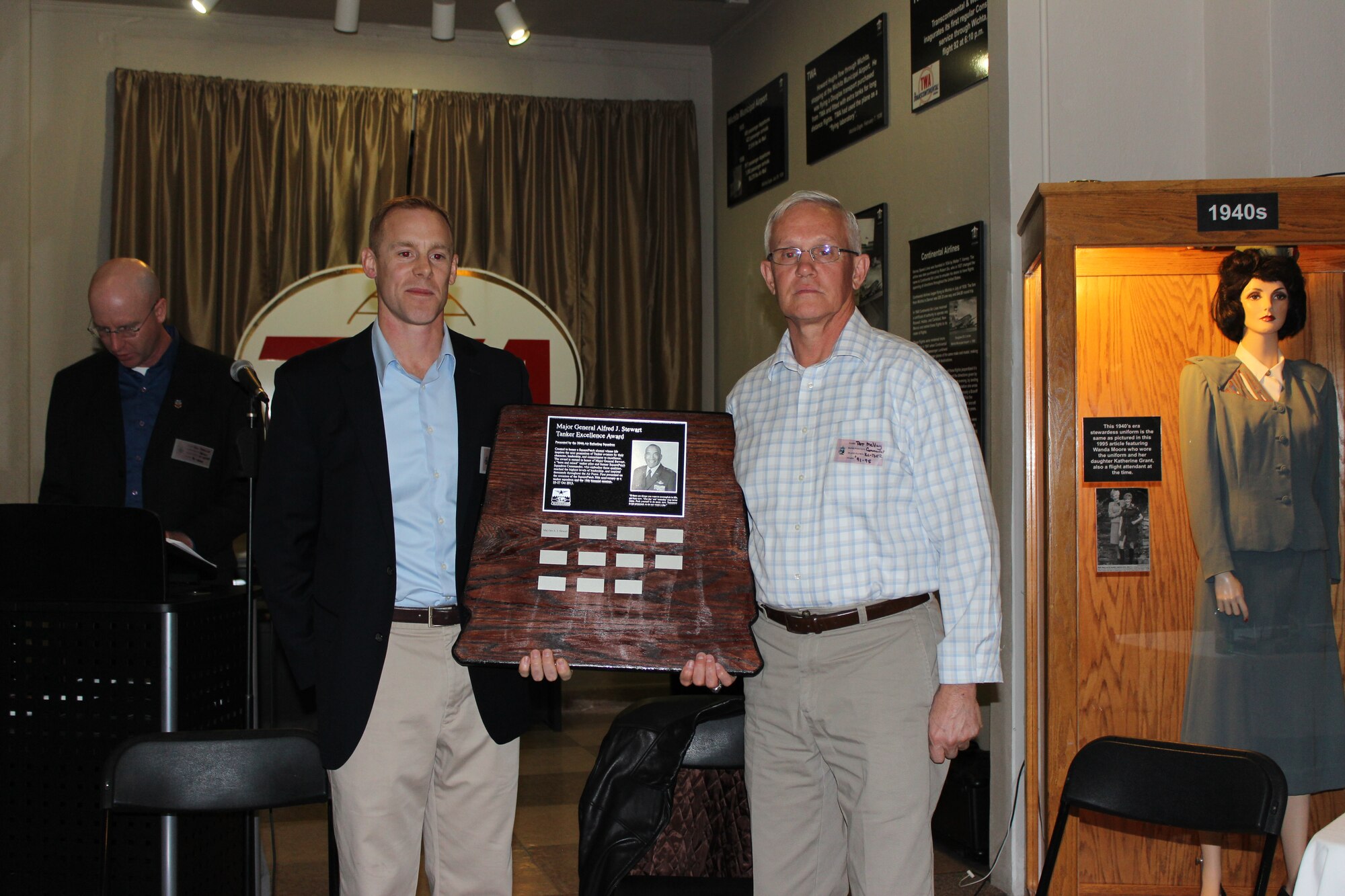 (Left to right) Lt. Col. Ben Jonsson, 384th Air Refueling Squadron commander, and retired Col. Pat McVay, former 384th ARS commander, pose with the Maj. Gen. A. J. Stewart Tanker Excellence Award Oct. 26, 2013, at McConnell Air Force Base. (Courtesy photo)