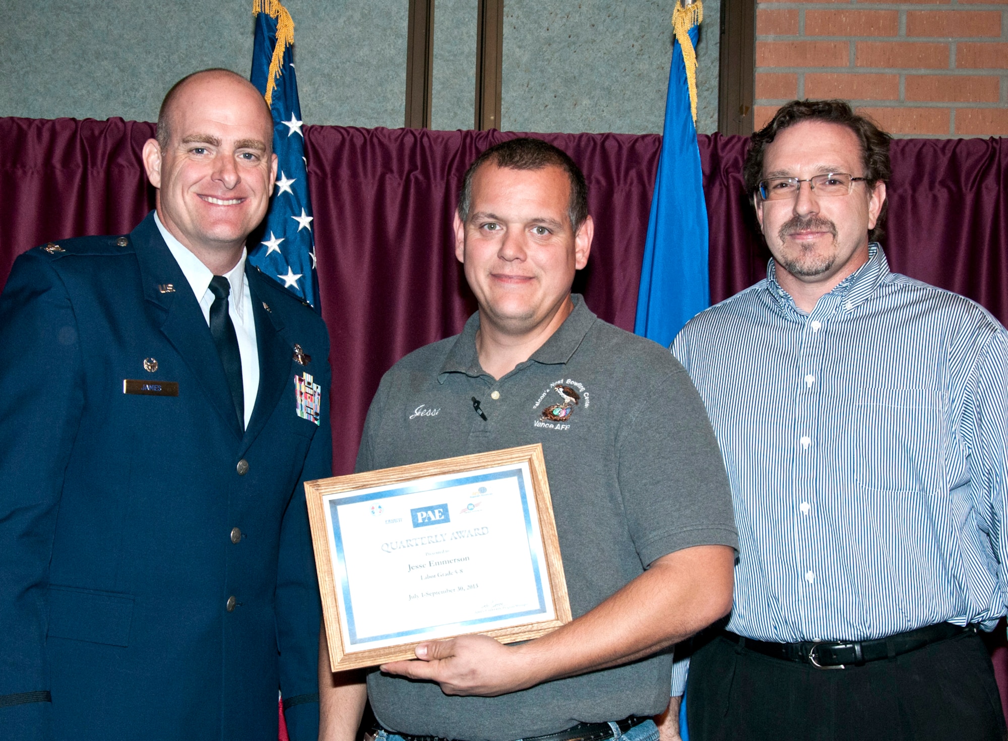 Jesse Emmerson, center, with the Falcon’s Nest Bowling Center, is the PAE Labor Grade 5-8 Employee of the Quarter. Col. Darren James, left, 71st Flying Training Wing commander, and Todd Nahnsen, right, the PAE Aircraft Maintenance director, presented Emmerson his award during a luncheon Oct. 22, at the Vance Collocated Club. (U.S. Air Force photo/ Terry Wasson)