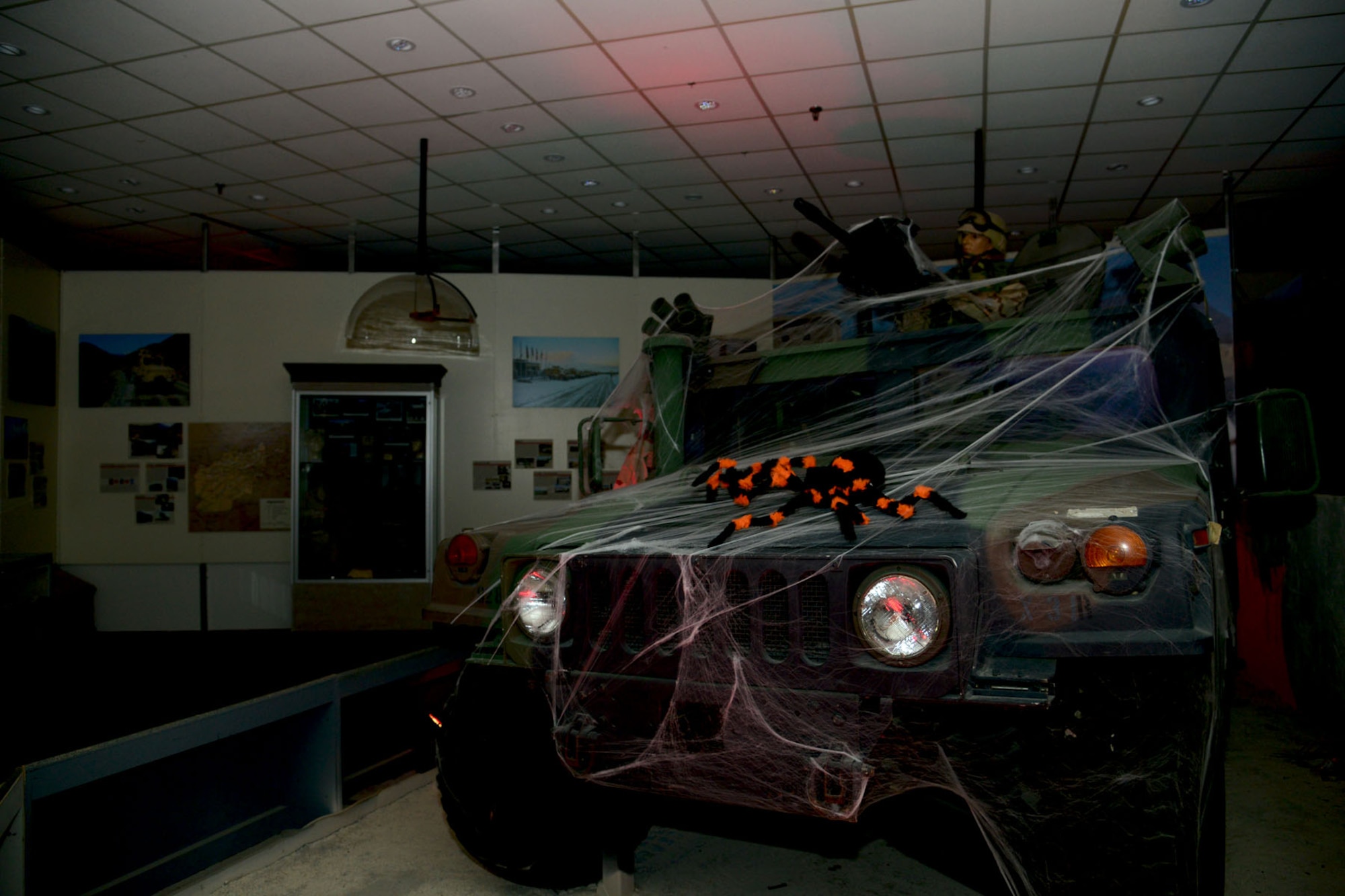 A giant spider sits on a Humvee at the U.S. Army Transportation Museum's "Night at the Transportation Museum" event at Fort Eustis, Va., Oct. 28, 2013. Volunteers from Joint Base Langley-Eustis and the surrounding community helped transform the museum into a haunted house style attraction. (U.S. Air Force photo by Staff Sgt. Ashley Hawkins/Released)