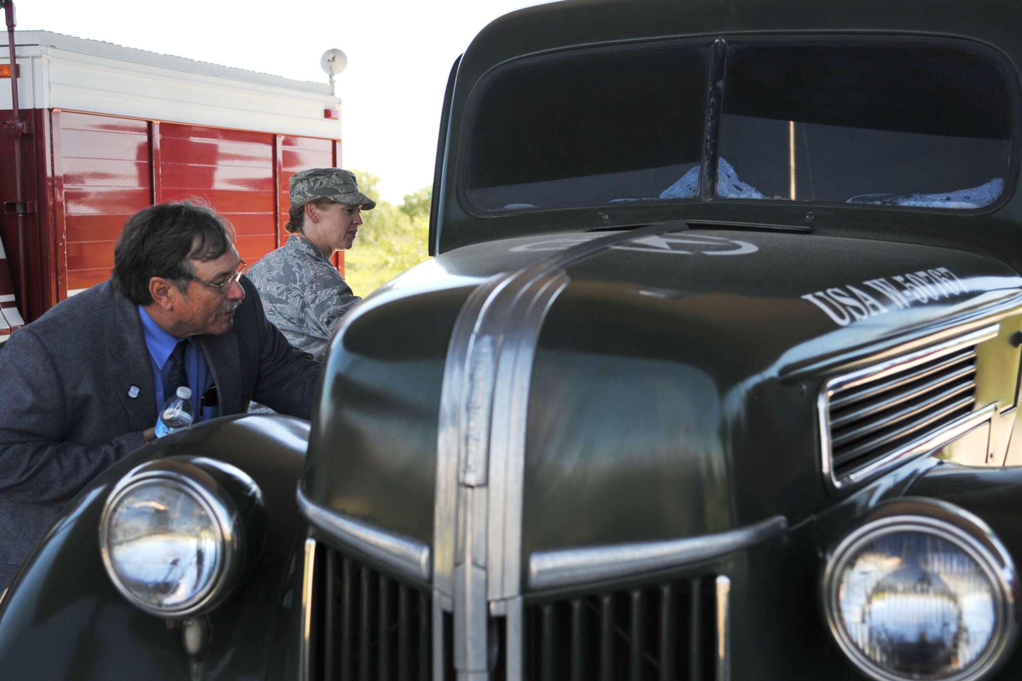 GOODFELLOW AIR FORCE BASE, Texas-- The Honorable Dwain Morrison, Mayor of San Angelo, Texas, and Col. Kimberlee Joos, 17th Training Wing Commander, look at a retired Ford Pumper at the Department of Defense Fallen Firefighter Heritage Memorial Oct. 25. The memorial is the world's largest exhibit of military firefighting vehicles. (U.S. Air Force photo/ Senior Airman Michael Smith)
