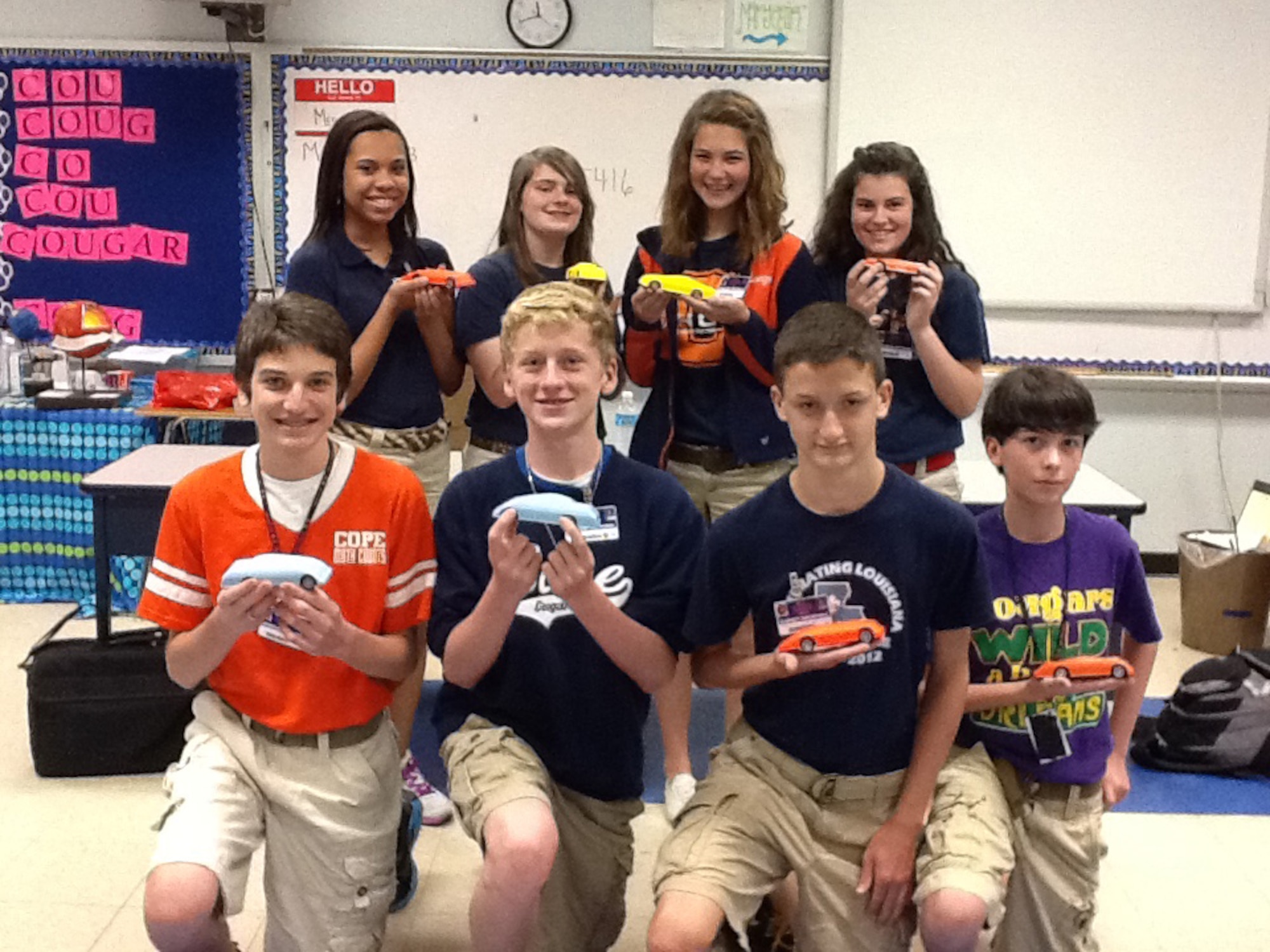 Starbase Louisiana students from Cope Middle School show off slot car designs they developed using computer-aided design software on Barksdale Air Force Base, La., May 9, 2013. Students were able to manufacture their own designs using 3D printing while learning about engineering. (Photo provided by Starbase Louisiana)