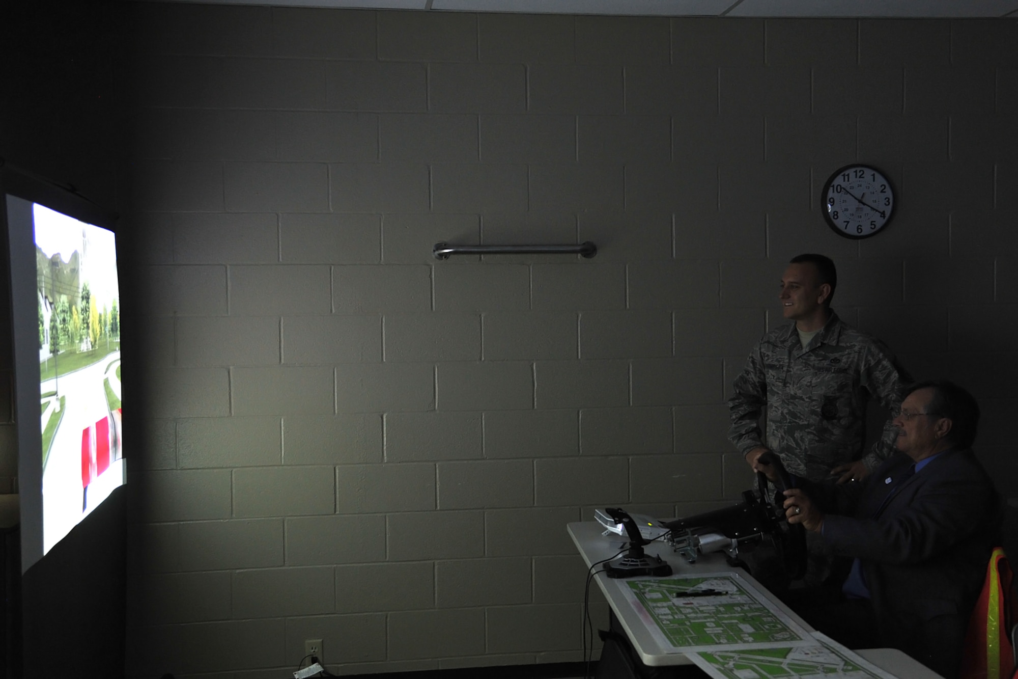 GOODFELLOW AIR FORCE BASE, Texas-- The Honorable Dwain Morrison, Mayor of San Angelo, Texas, tests the Advanced Disaster Management Simulator at the Louis F. Garland Department of Defense Fire Academy Oct. 25. The ADMS simulator includes a virtual replica of the Norma Brown trainer, staffed vehicles and a variety of scenarios including aircraft and structural fires. (U.S. Air Force photo/ Senior Airman Michael Smith)