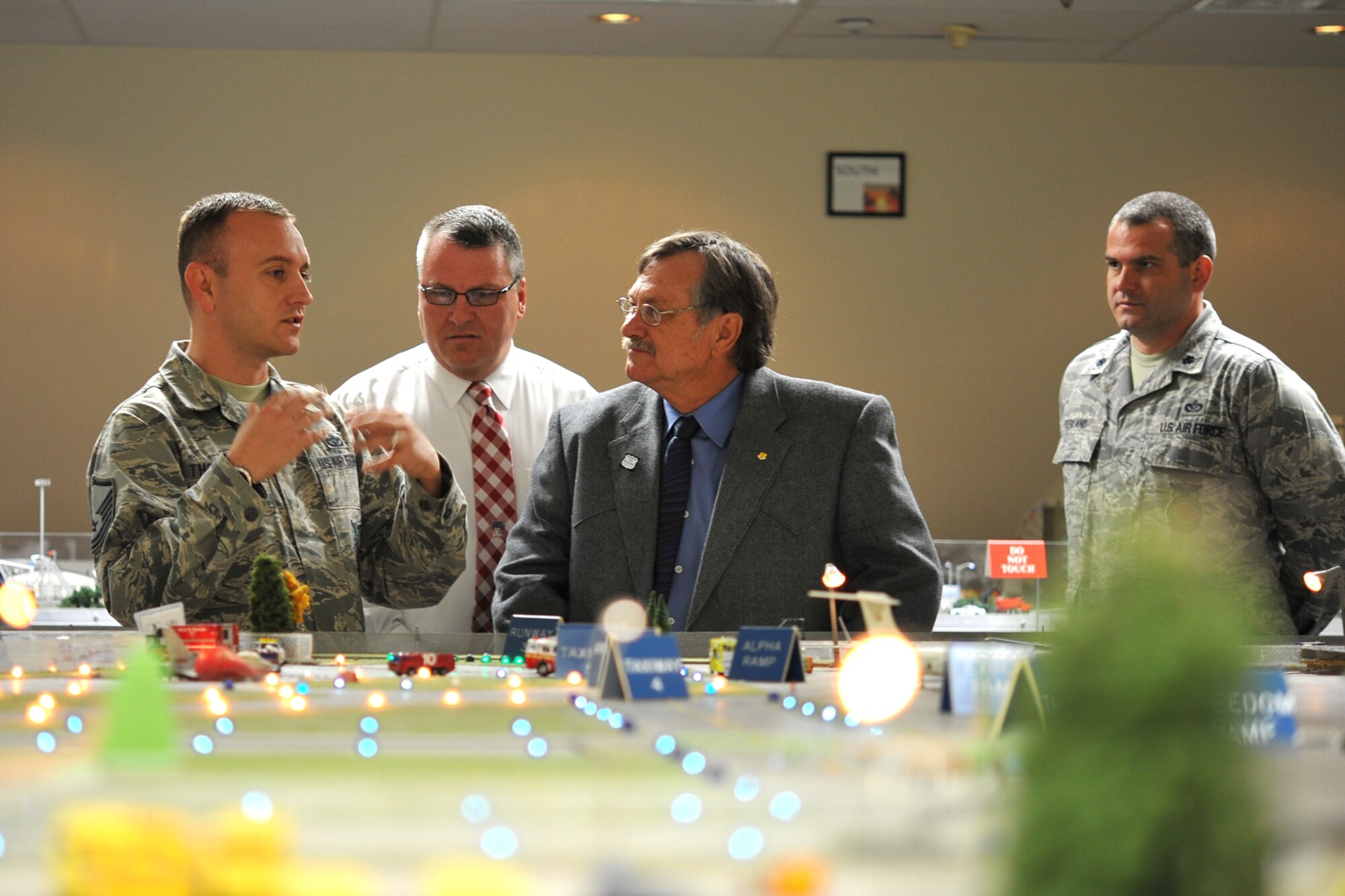 GOODFELLOW AIR FORCE BASE, Texas-- Master Sgt. Stephen Thompson, 312th Training Squadron instructor, explains the Norma Brown trainer to the Honorable Dwain Morrison, Mayor of San Angelo, Texas, and Rodney Fleming, San Angelo City Council member, at the Louis F. Garland Department of Defense Fire Academy Oct. 25. The Norma Brown trainer gives students the opportunity to build on-scene commander experience. (U.S. Air Force photo/ Senior Airman Michael Smith)