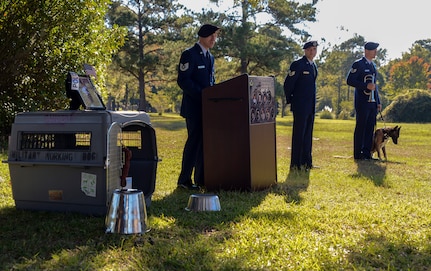 The 628th Security Forces Squadron Airmen hold a burial ceremony for military working dog Athos on Oct. 24, 2013, at Joint Base Charleston – Air Base, S.C. Athos was born Aug. 1998 and passed away Oct. 2012. Athos served as an explosive detector dog for 11 years. He was returned to JB Charleston where his ashes were buried alongside his fellow military working dogs. (U.S. Air Force photo/ Airman 1st Class Chacarra Neal)