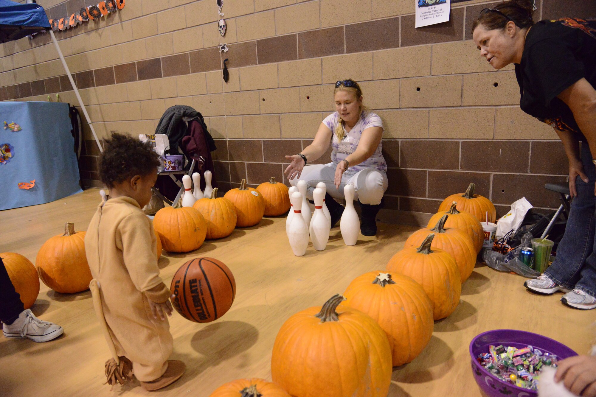 Friday evening’s Bootastic fall carnival at the youth center was a success, with hundreds of children in costume. The carnival featured a haunted house, an obstacle course, a variety of games, dozens of vendors and “trunk-or-treat."  (Photo by Ken Moore)