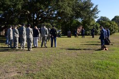 The 628th Security Forces Squadron Airmen hold a burial ceremony for military working dog Athos Oct. 24, 2013, at Joint Base Charleston – Air Base, S.C. Athos was born in August 1998 and passed away in October 2012. Athos served as an explosive detector dog for 11 years. He was returned to JB Charleston where his ashes were buried alongside his fellow military working dogs. (U.S. Air Force photo/Airman 1st Class Chacarra Neal) 

