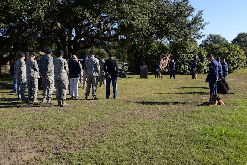 The 628th Security Forces Squadron Airmen hold a burial ceremony for military working dog Athos on Oct. 24, 2013, at Joint Base Charleston – Air Base, S.C. Athos was born Aug. 1998 and passed away Oct. 2012. Athos served as an explosive detector dog for 11 years. He was returned to JB Charleston where his ashes were buried alongside his fellow military working dogs. (U.S. Air Force photo/ Airman 1st Class Chacarra Neal)